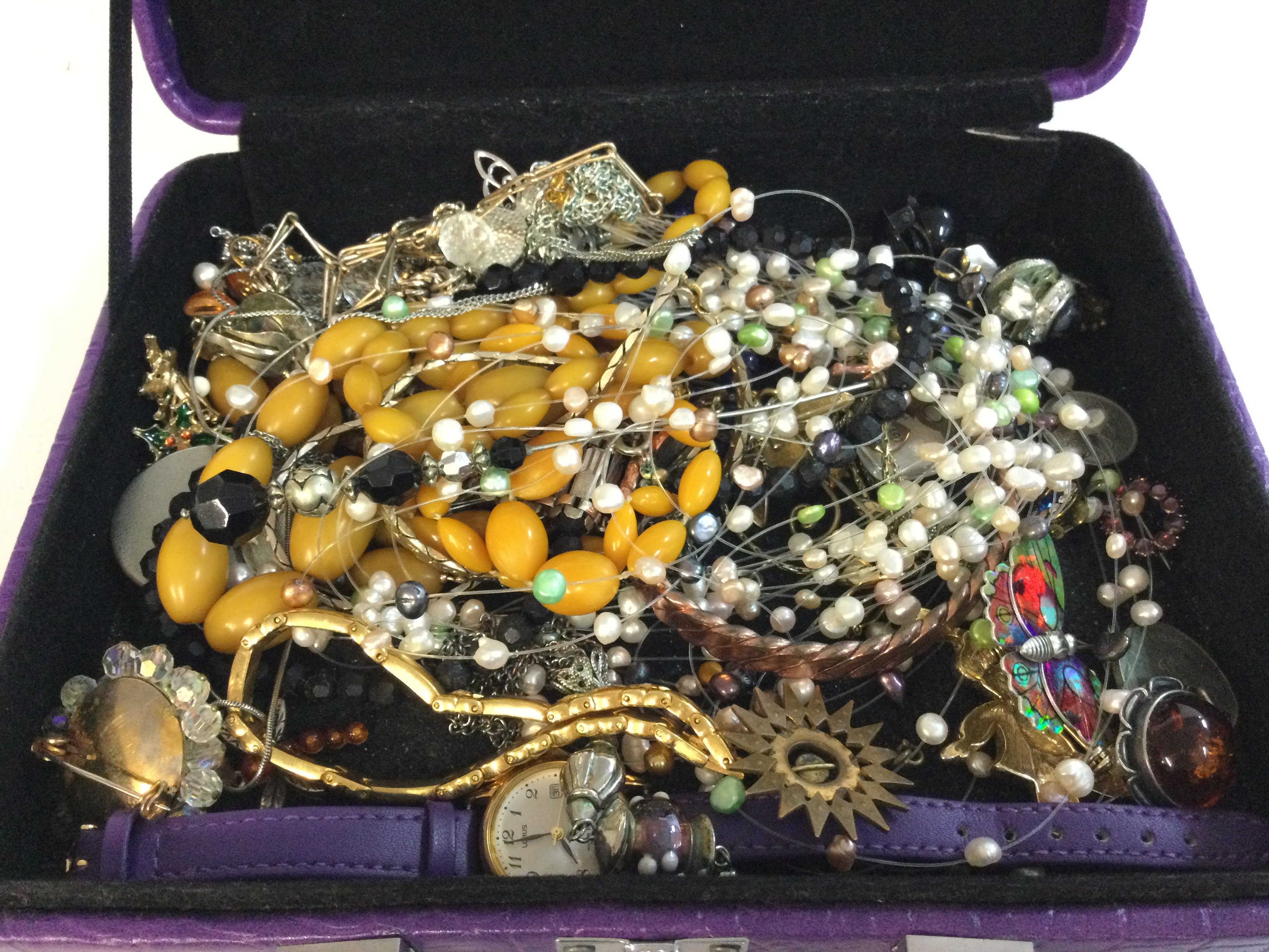 A small collection of costume jewellery including some silver. Postage cat A