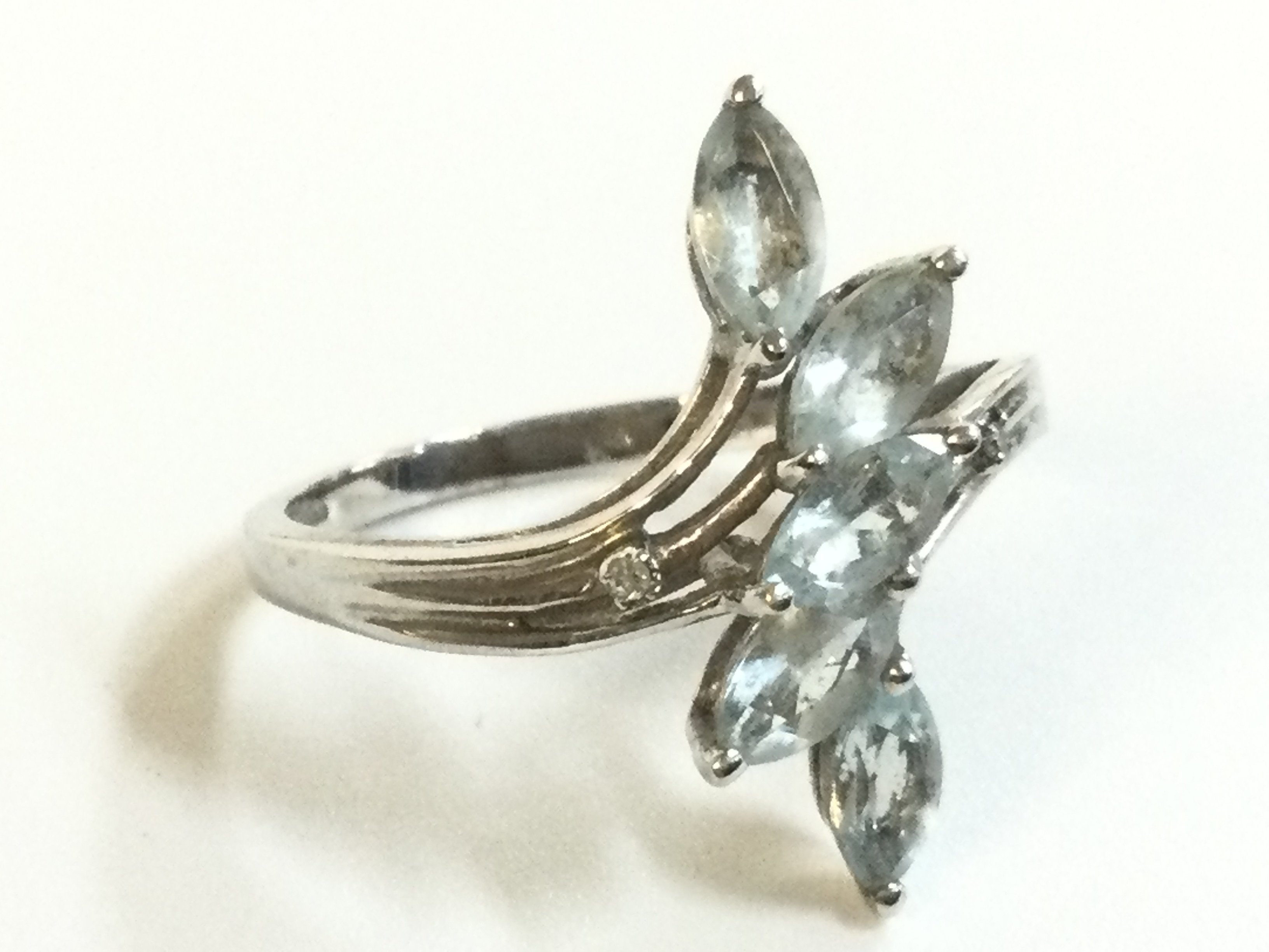 A 9ct white gold ring topaz ring, size R, 2.6g total weight. postage category A