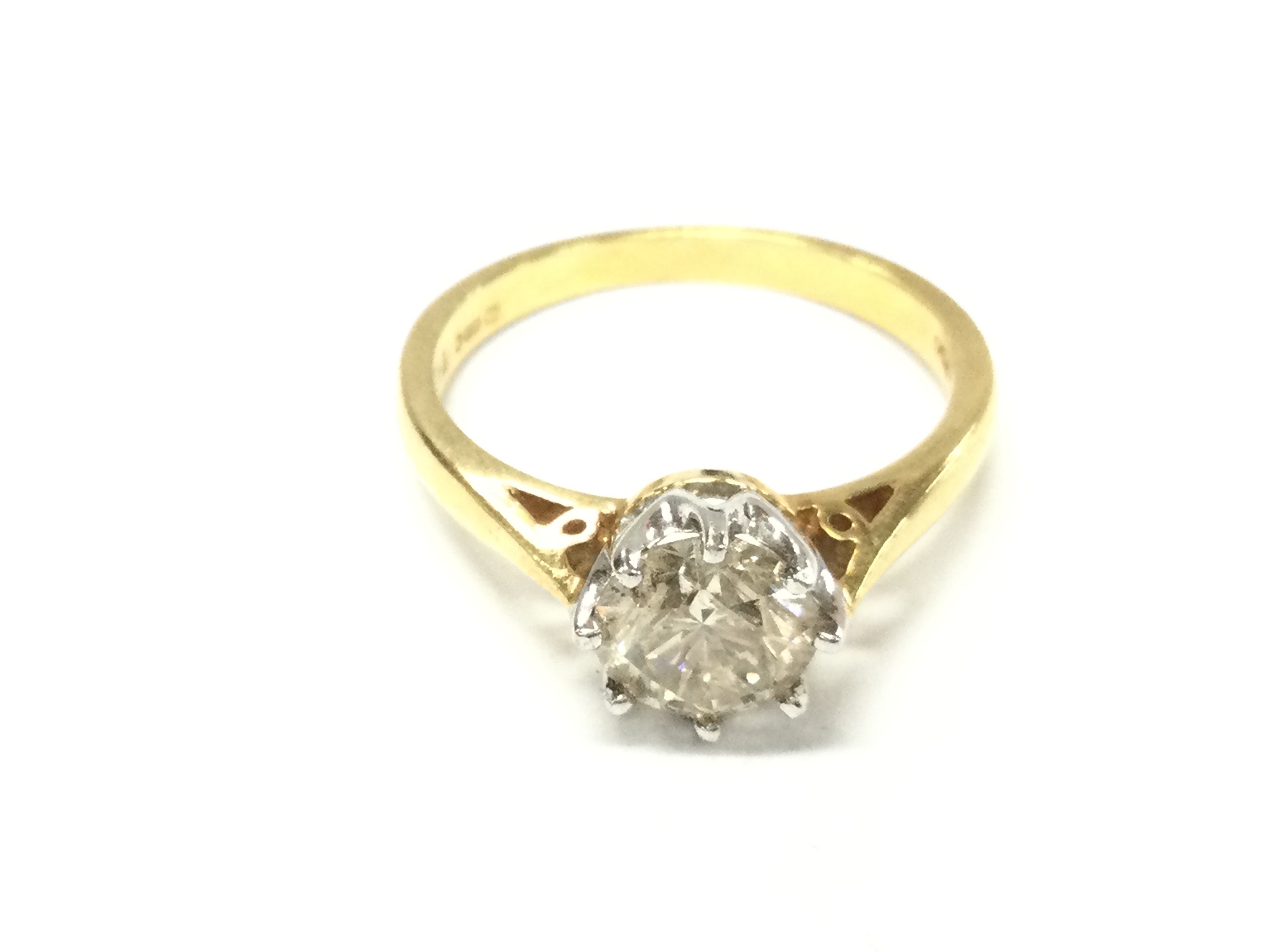 An 18ct gold diamond solitaire ring. Approximately 1.1ct and 3.3G size N