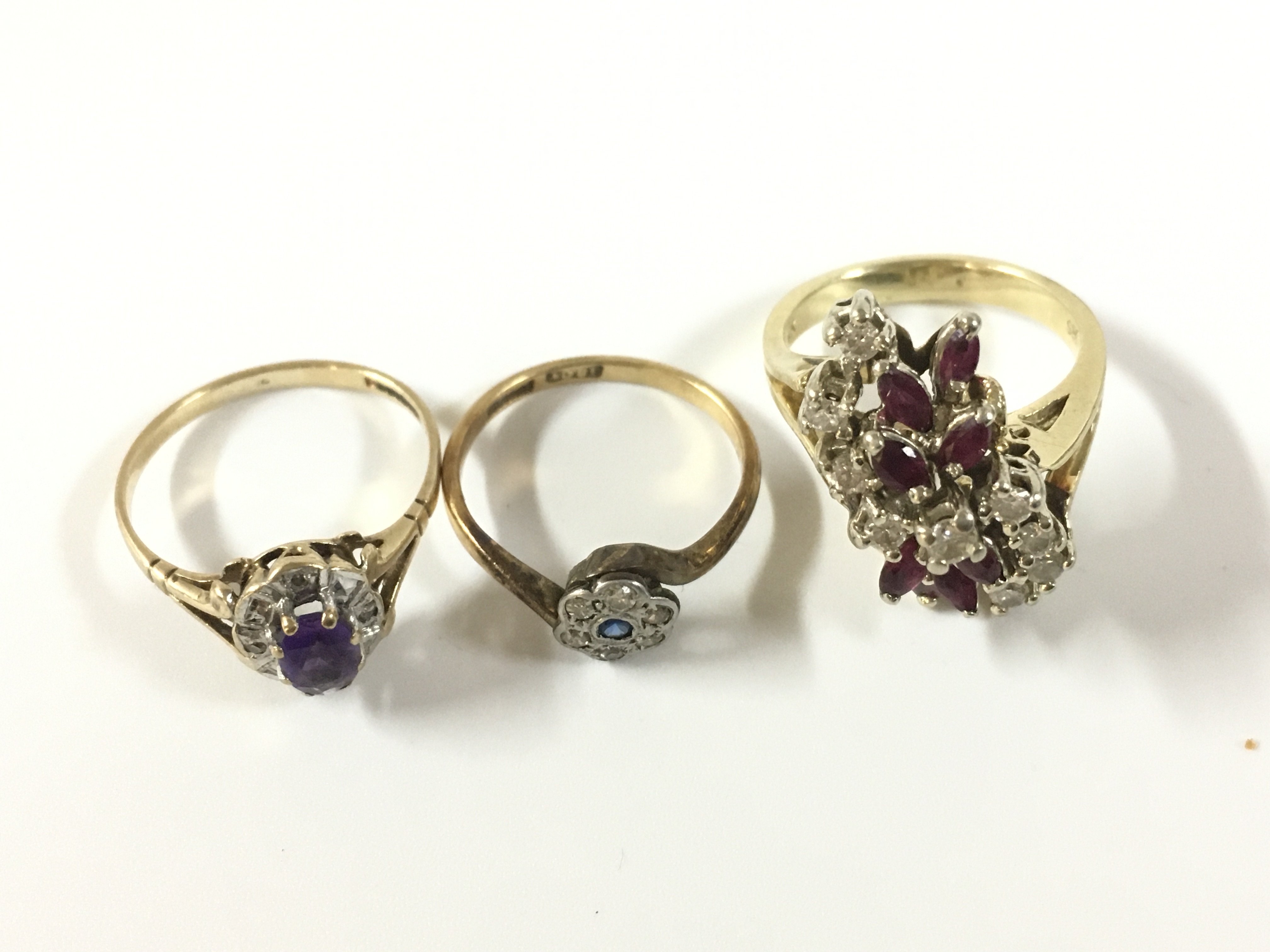 Three gold stone set rings 1x 18ct, 1x 14ct and 1x 9ct . Approx weight 18ct-1.30 grams, Approx 14ct weight- 6.65 grams, Approx 9ct weight 1.75 grams
