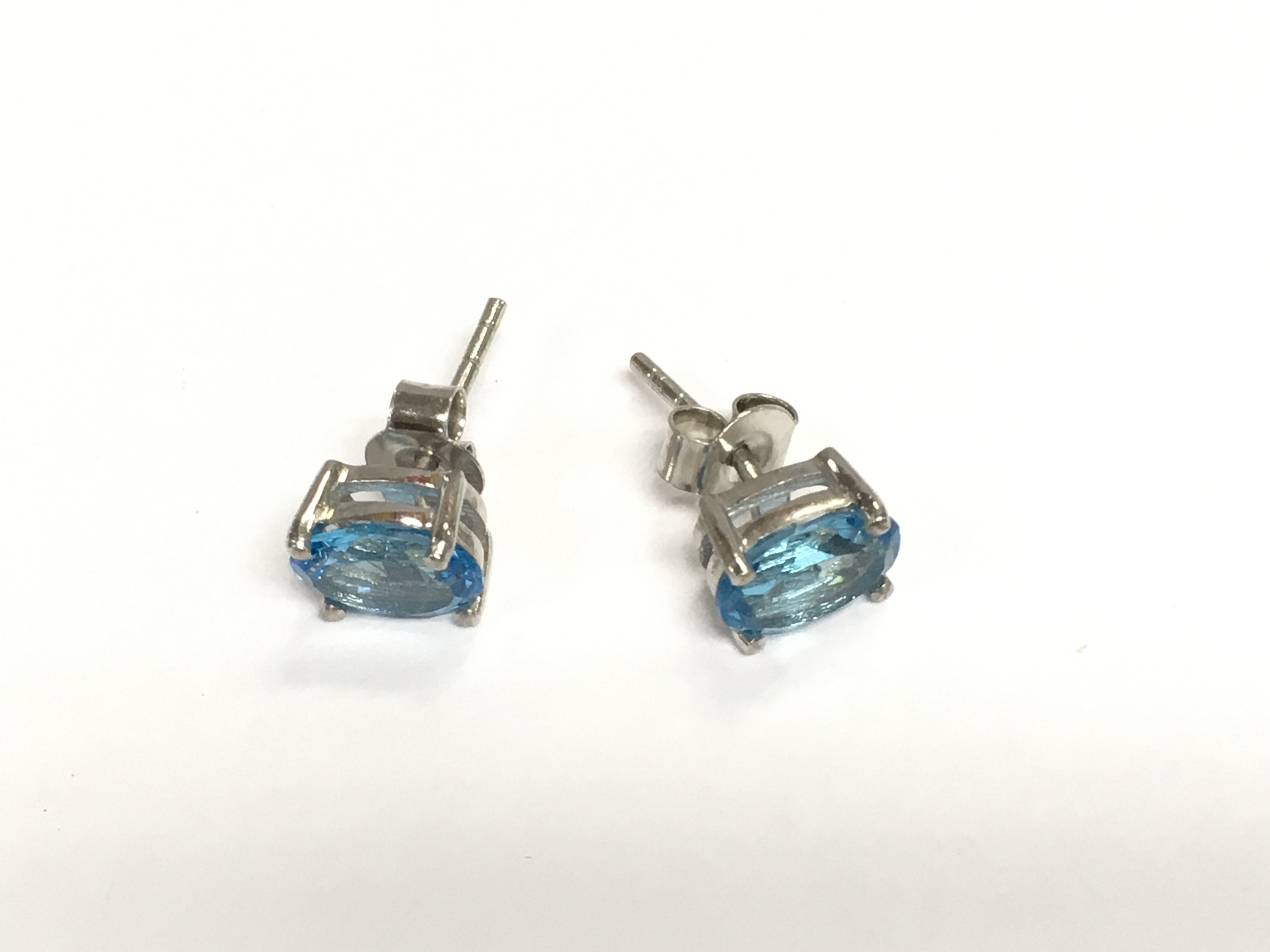 A pair of Swiss blue topaz studs in silver. Shipping category A.