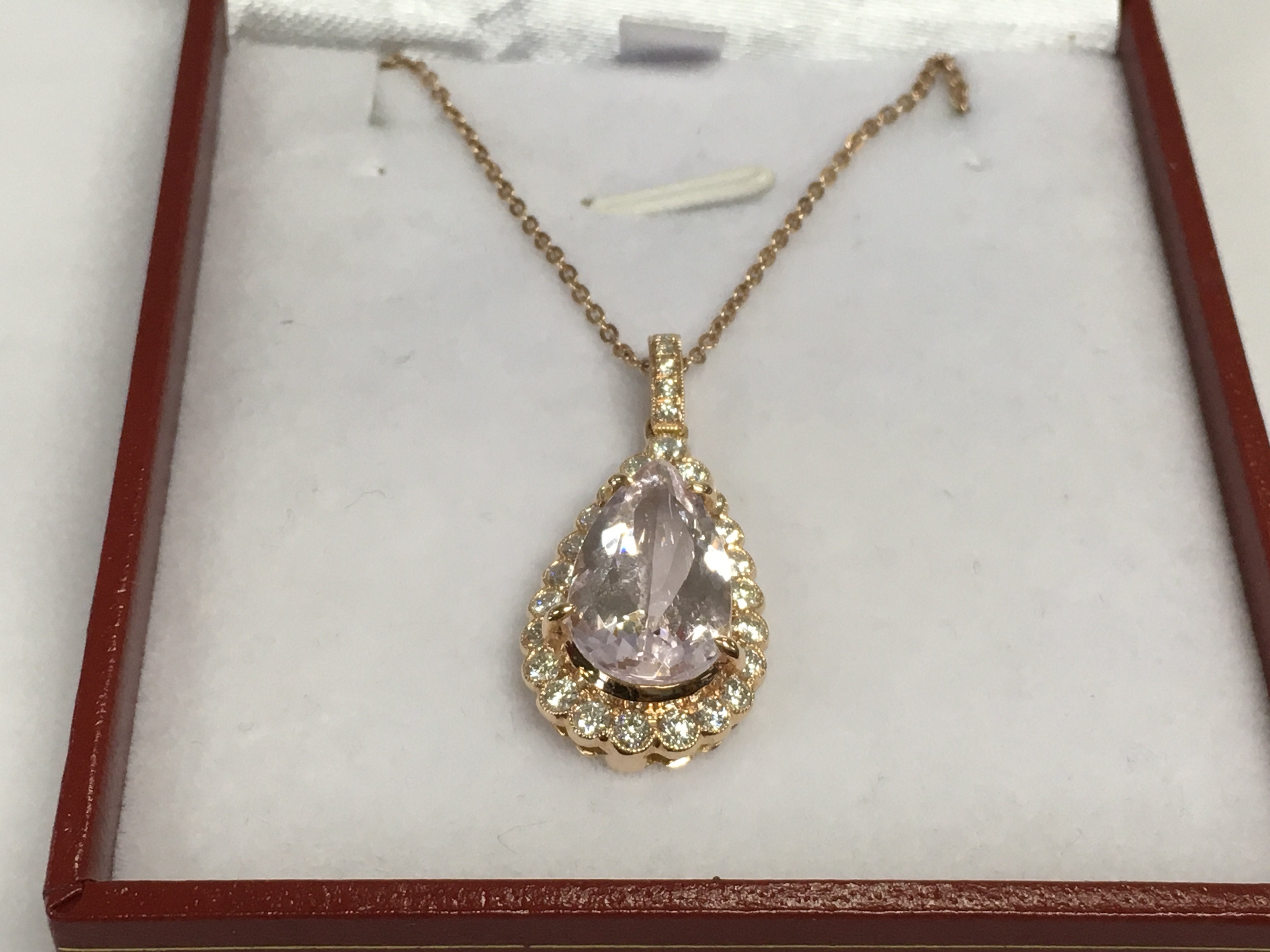 An 18ct rose gold pear shaped morganite and RBC diamond pendant on a rose gold plated chain. Morganite approx 3.88ct, diamonds approx 0.65ct. Approx 4.7g. Shipping category A.