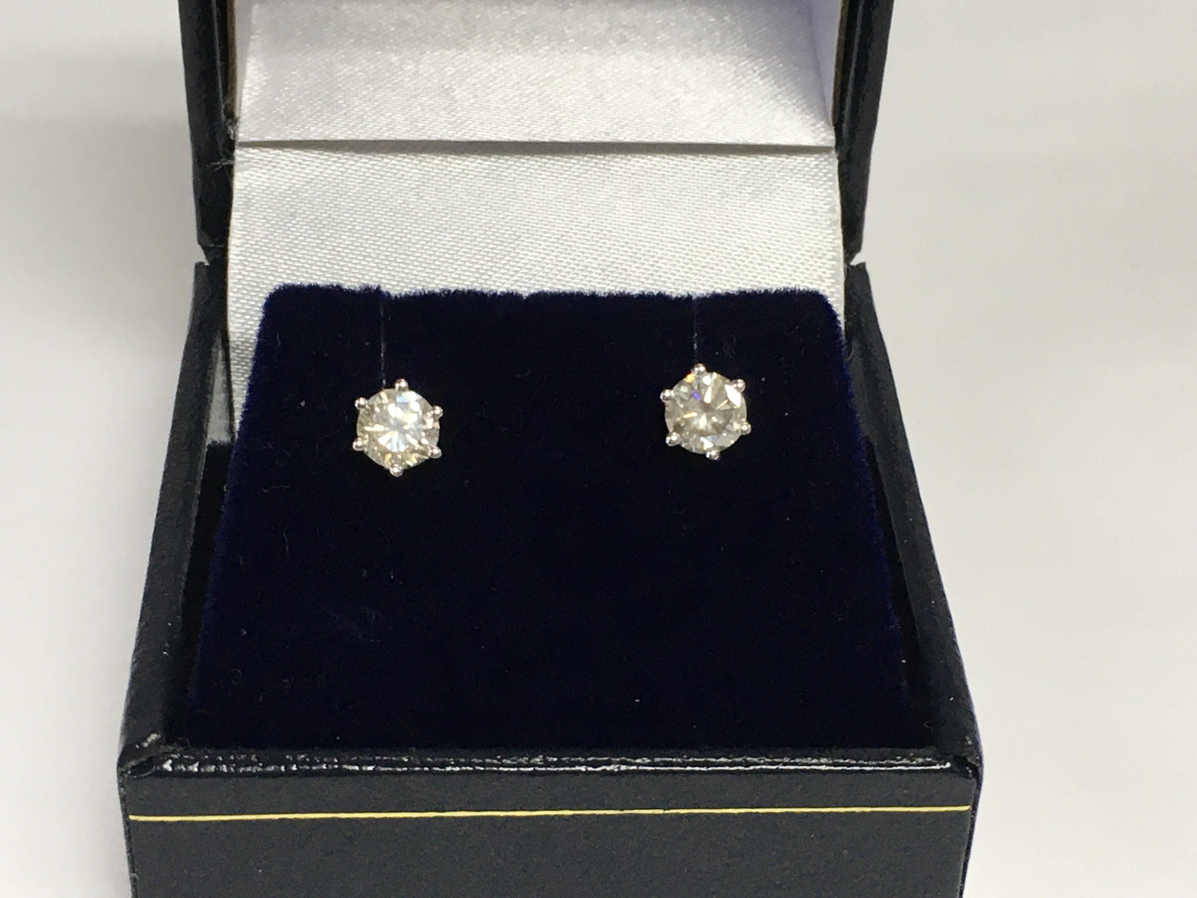 A pair of 18ct white gold six claw set RBC diamond solitaire studs. Diamonds approx 0.75ct. Shipping category A. Approx 1.3g. Shipping category A.