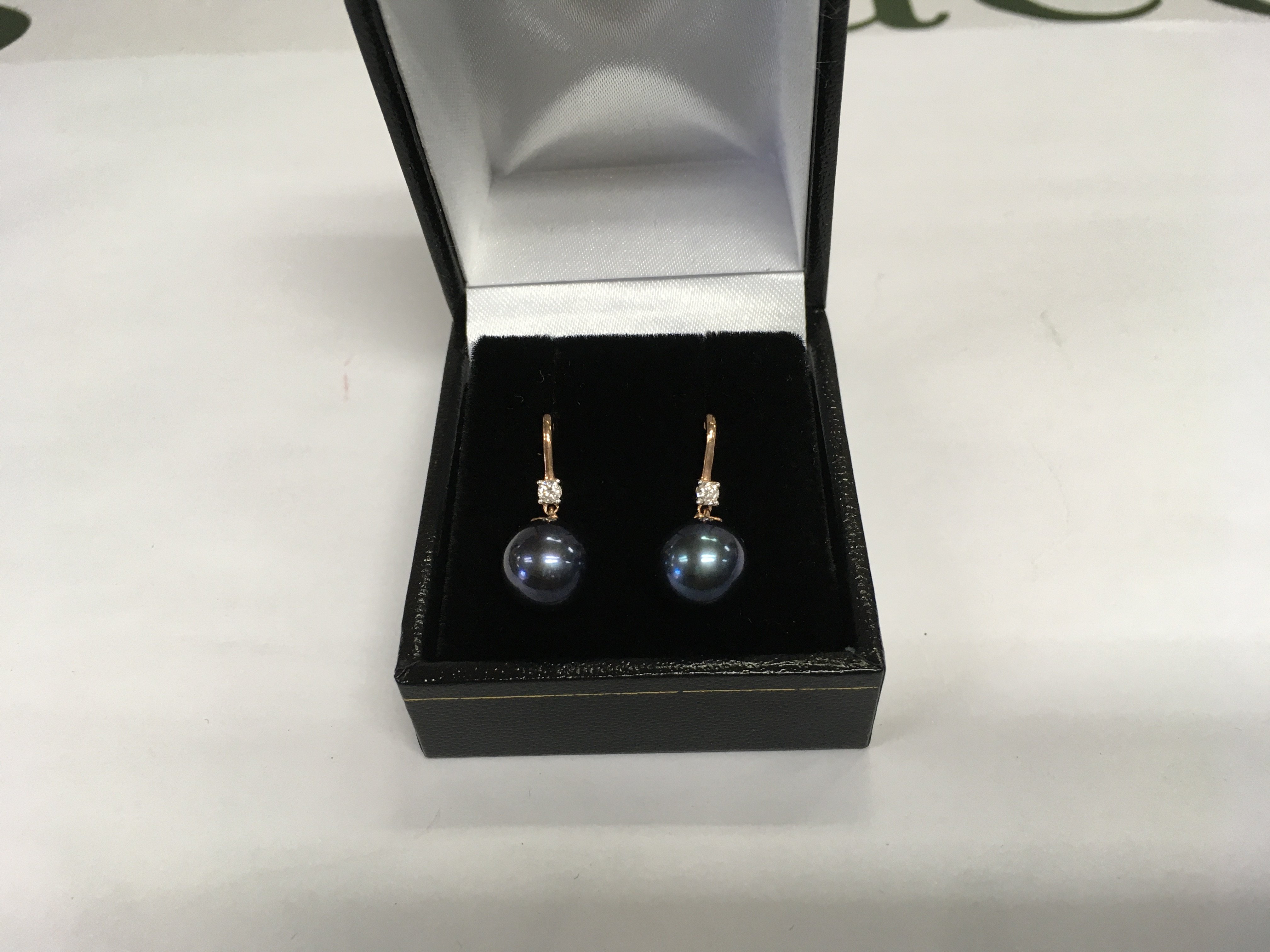 A pair of 9ct rose gold iridescent dark pearl and diamond droplet earrings. RBC diamonds approx 0.10ct. Approx 3g. Shipping category A.