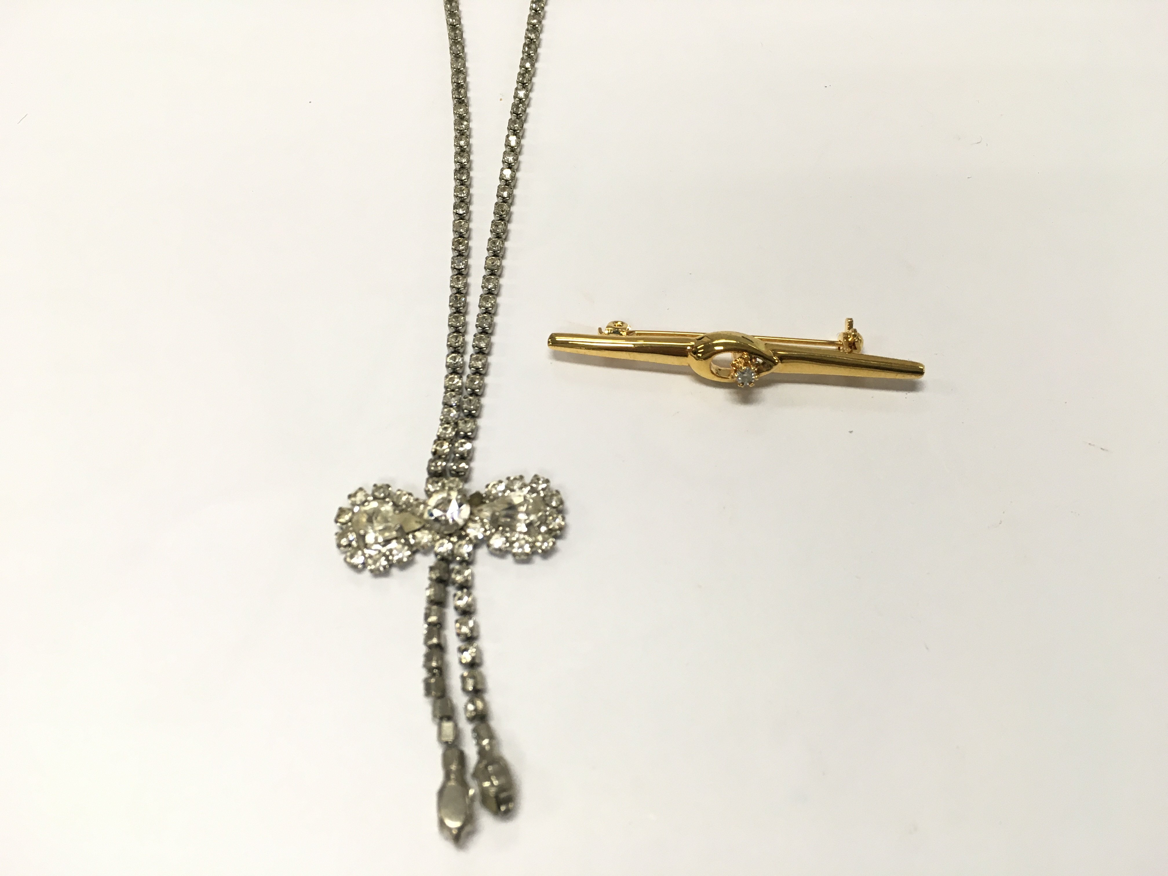 A costume jewellery brooch and necklace