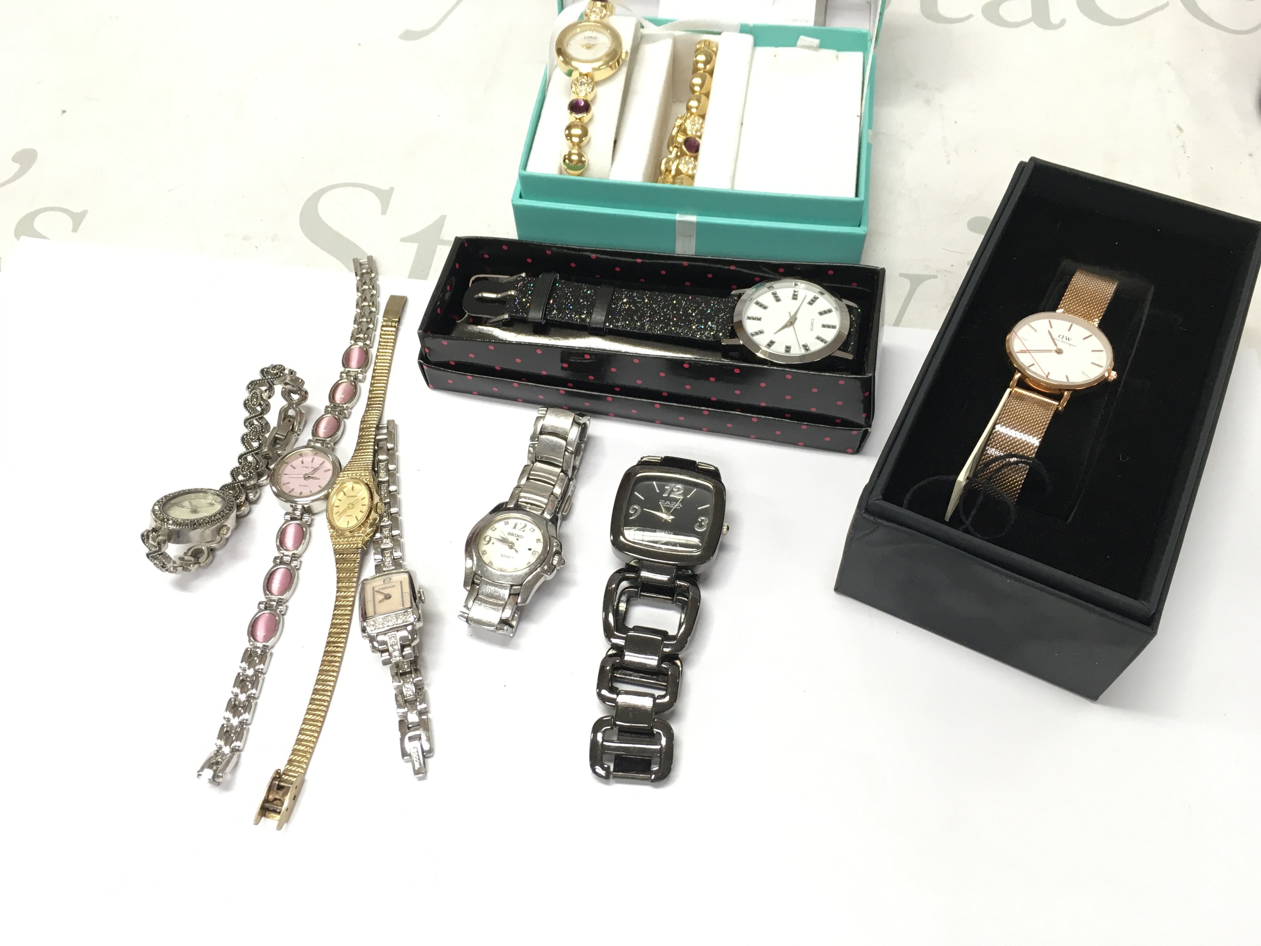 A collection of assorted ladies fashion watches including limit Seiko etc Postage B