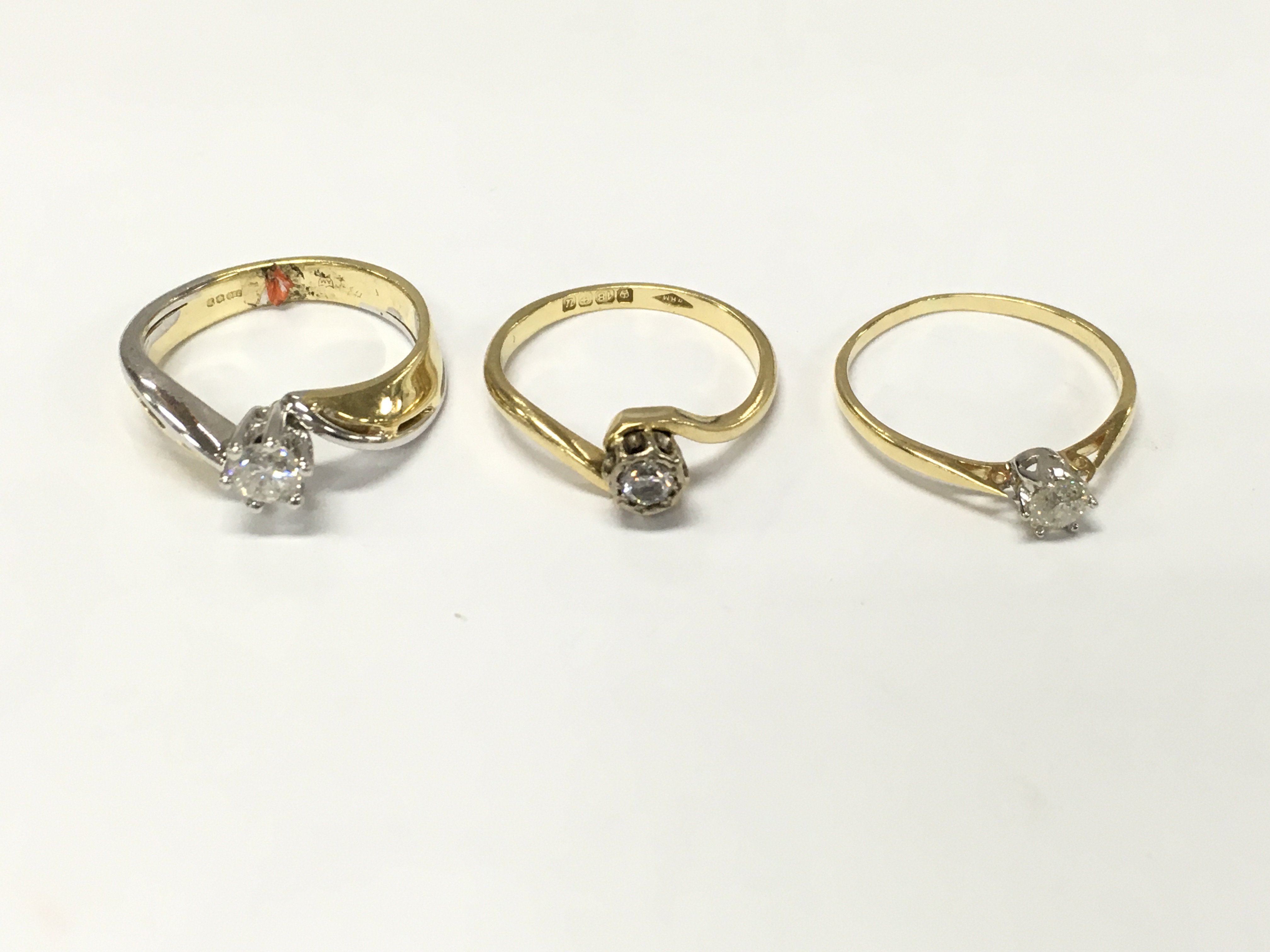 Three 18ct gold diamond solitaire rings. Sizes L and N approximately 9.10g