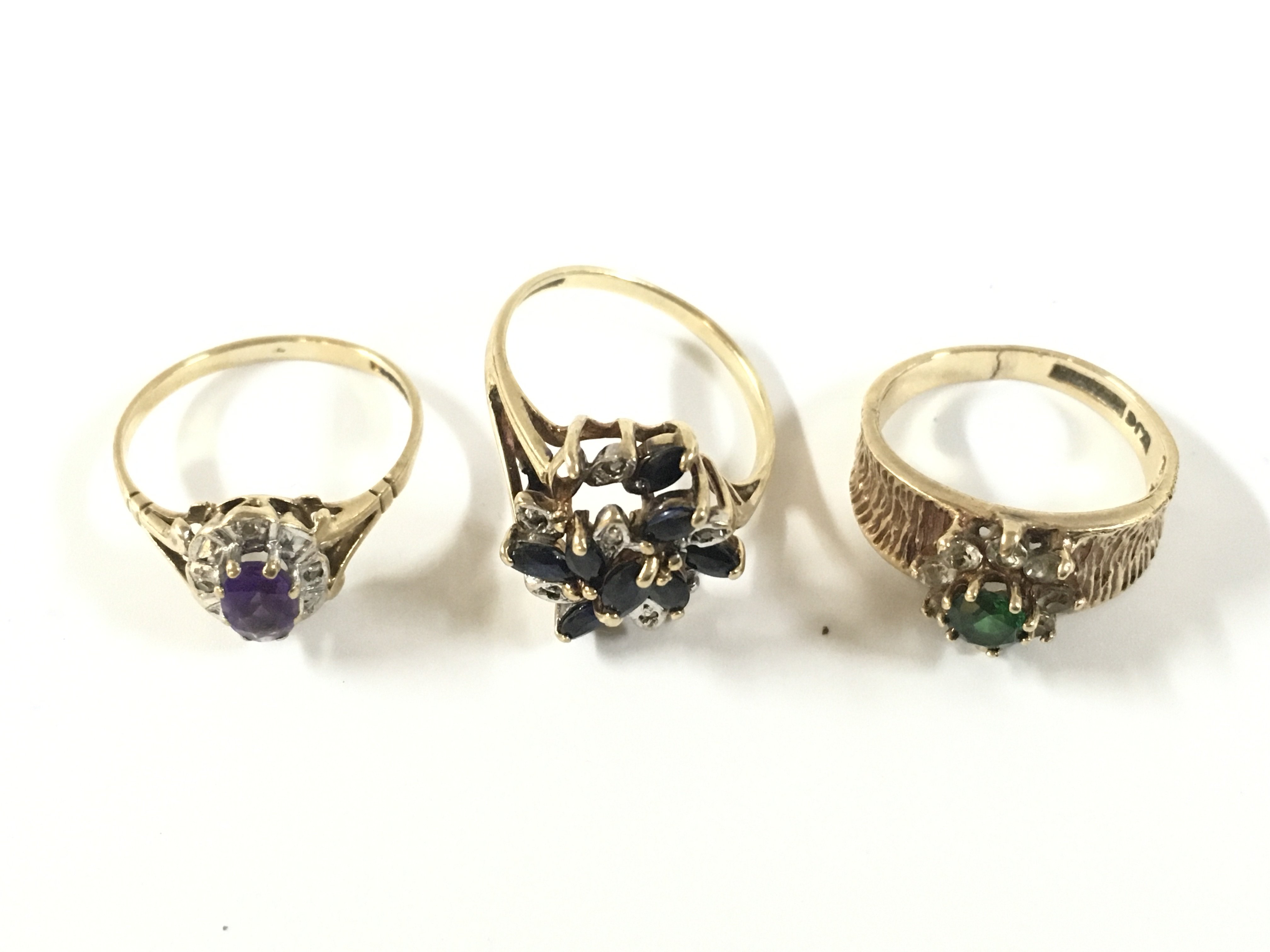 Three 9ct gold stone set ring approx weight, 7.36 grams.