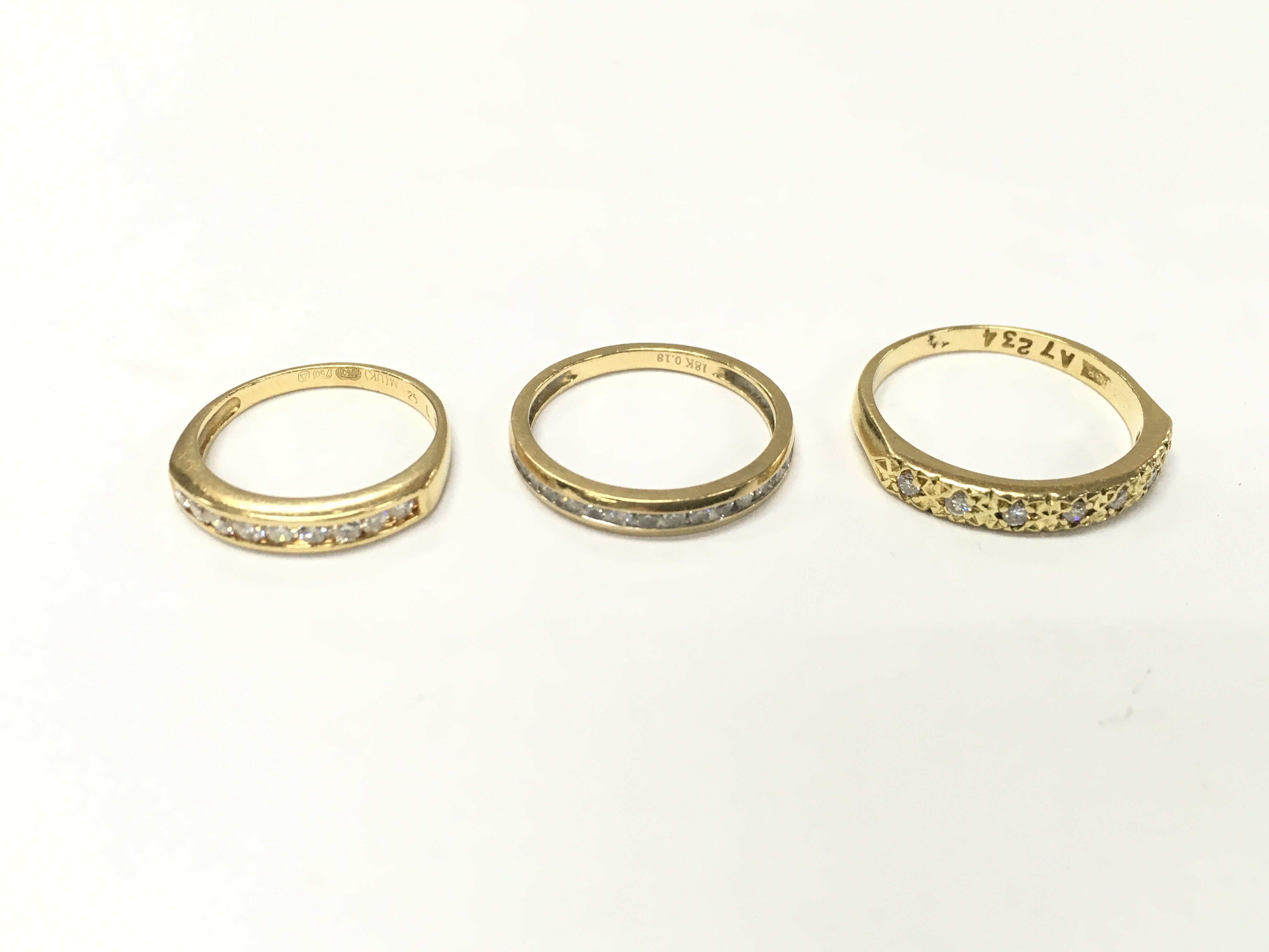 Three 18ct gold 1/2 hoop rings. Sizes H J and N approximately 6.5g