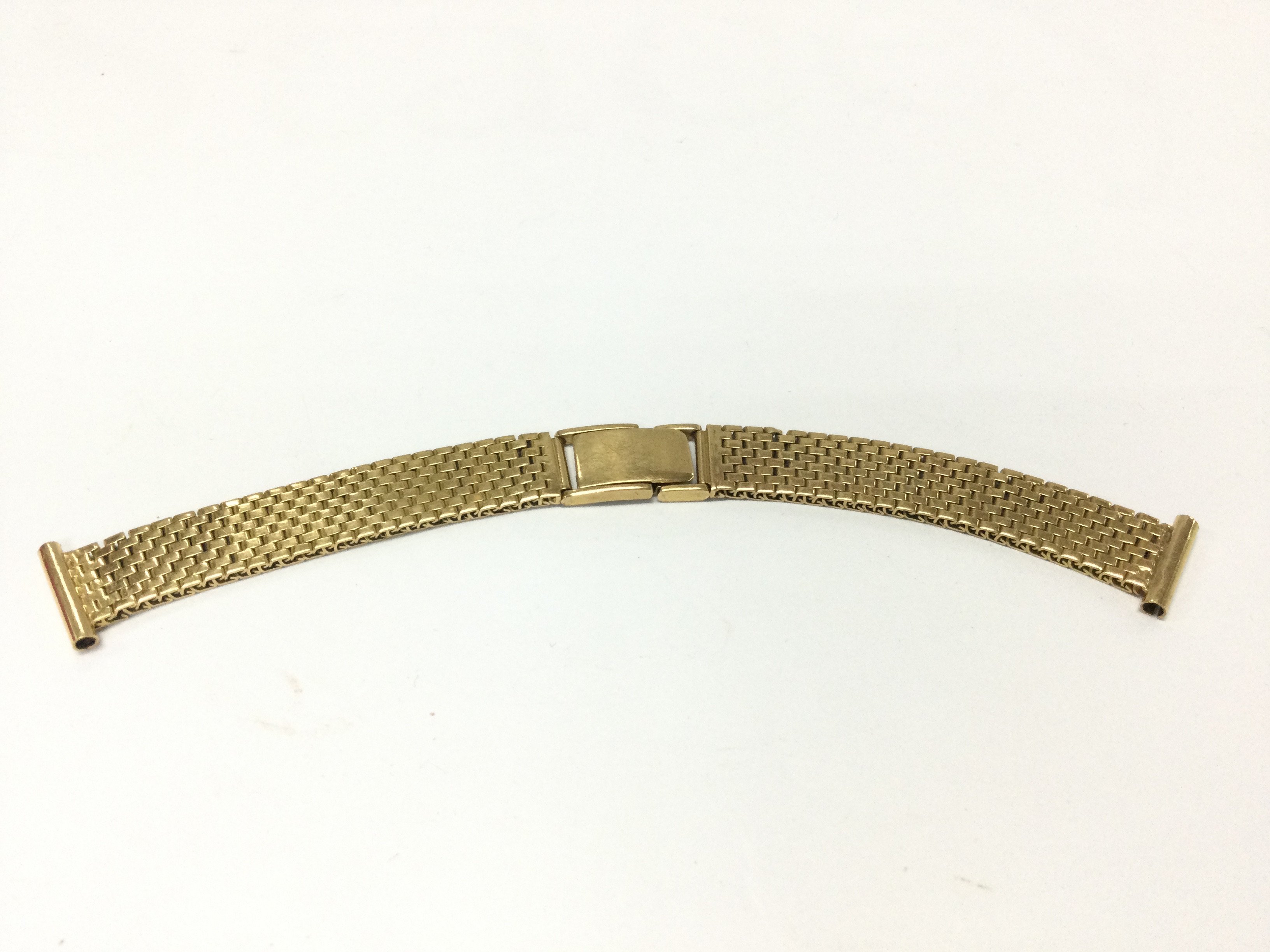 A 18ct gold watch strap. 30.88g