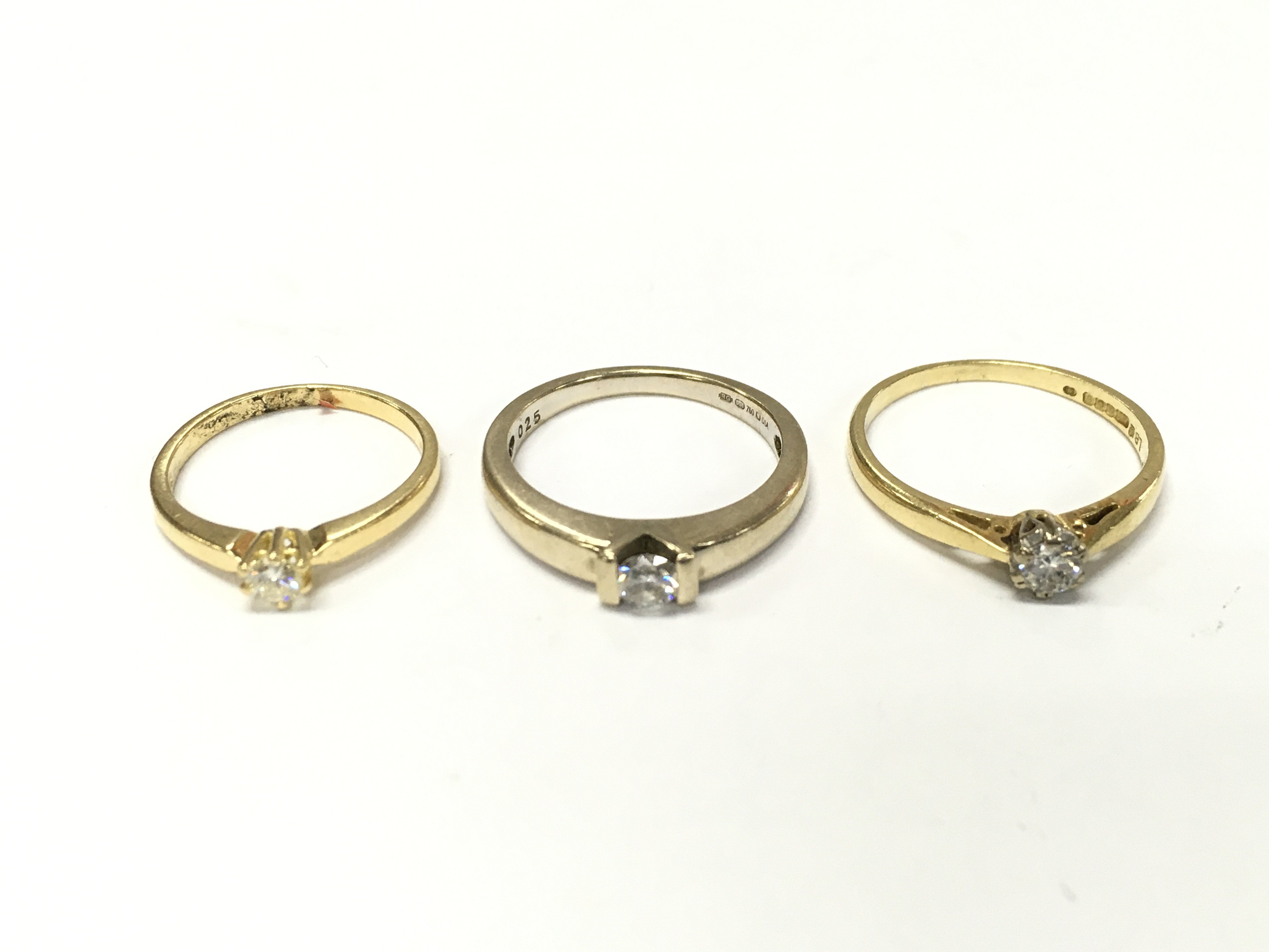 Three 18ct gold diamond solitaire rings sizes H 1/2 M and N approximately 7.5g