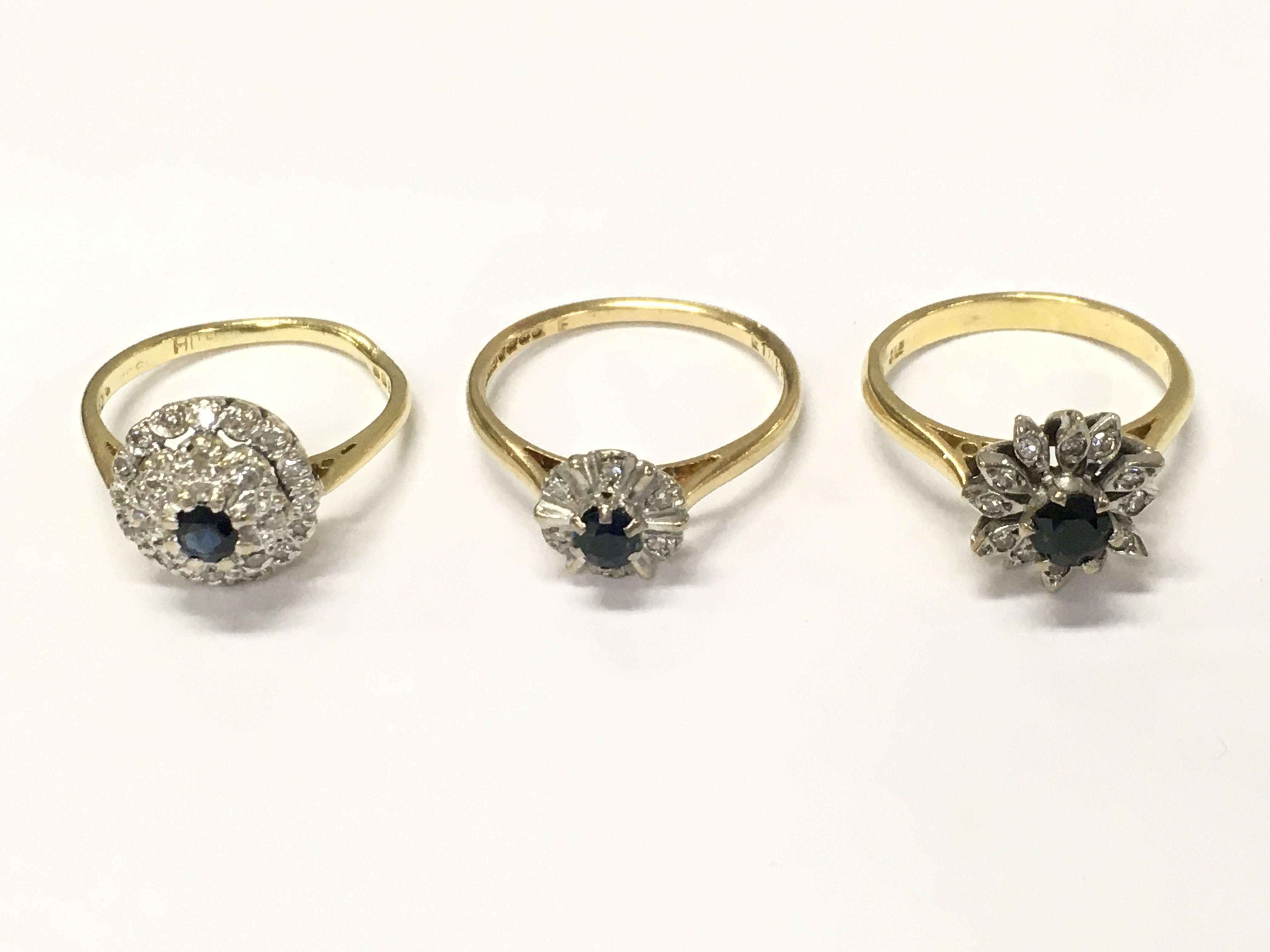 Three 18ct gold diamond and sapphire cluster rings sizes L M and O approximately 11g