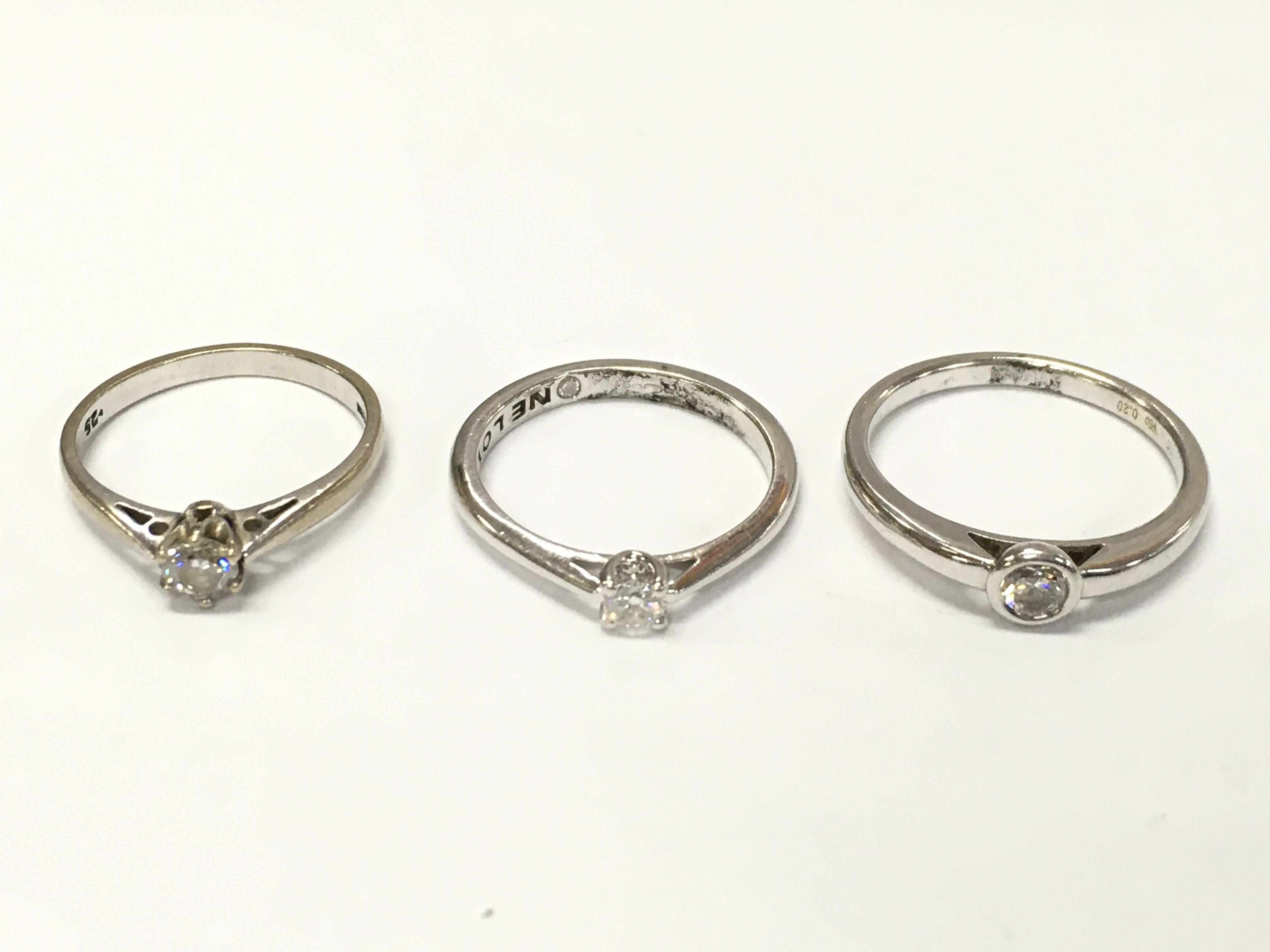 Three 18ct white gold diamond solitaire rings sizes K 1/2 L and O approximately 8.5g