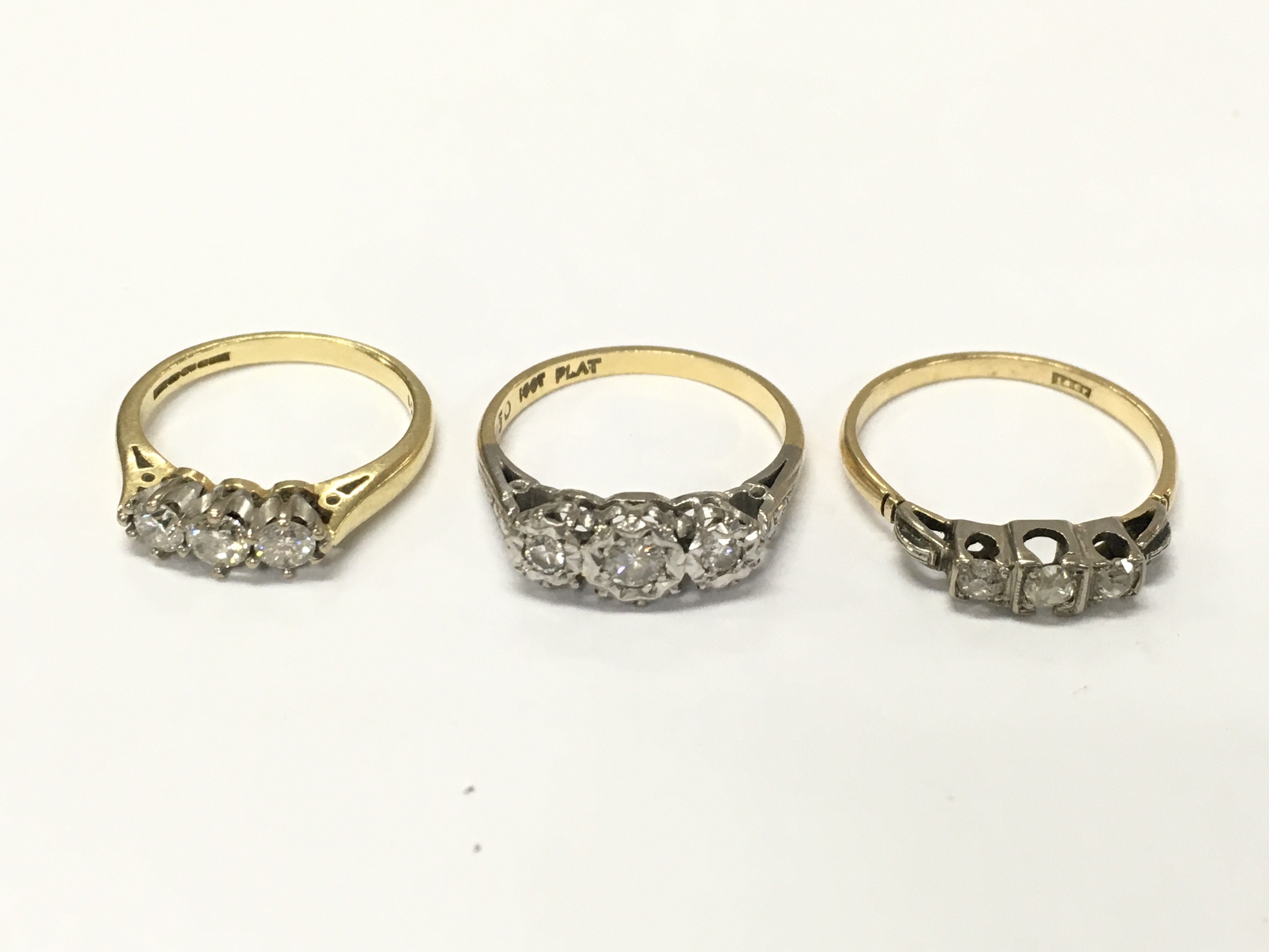 Three 18ct gold diamond three stone rings sizes K N and P approximately 8.4g