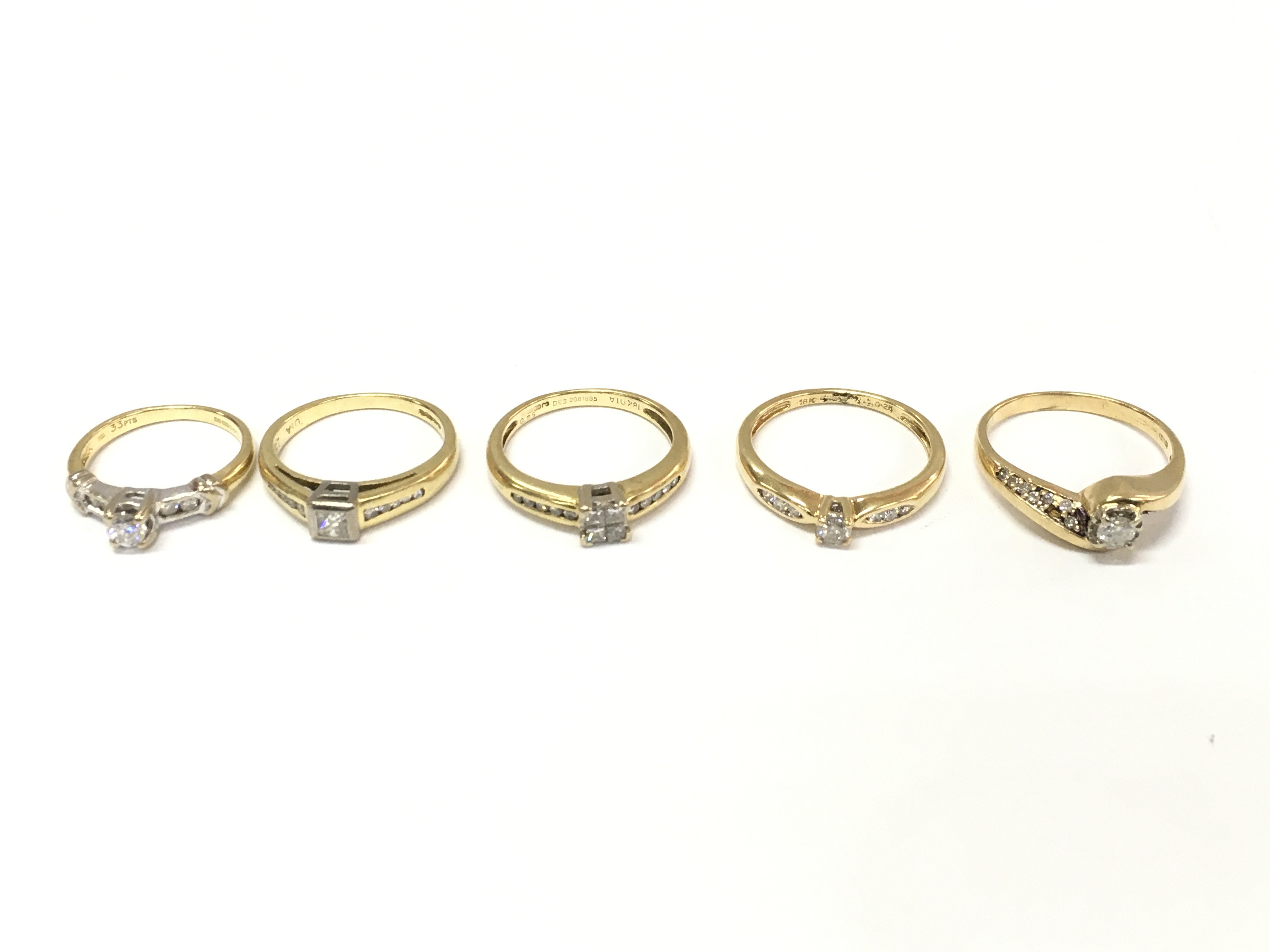 Five 18ct gold diamond solitaire rings with diamond shoulders. Sizes H 1/2 L N P appropriate 16.4g