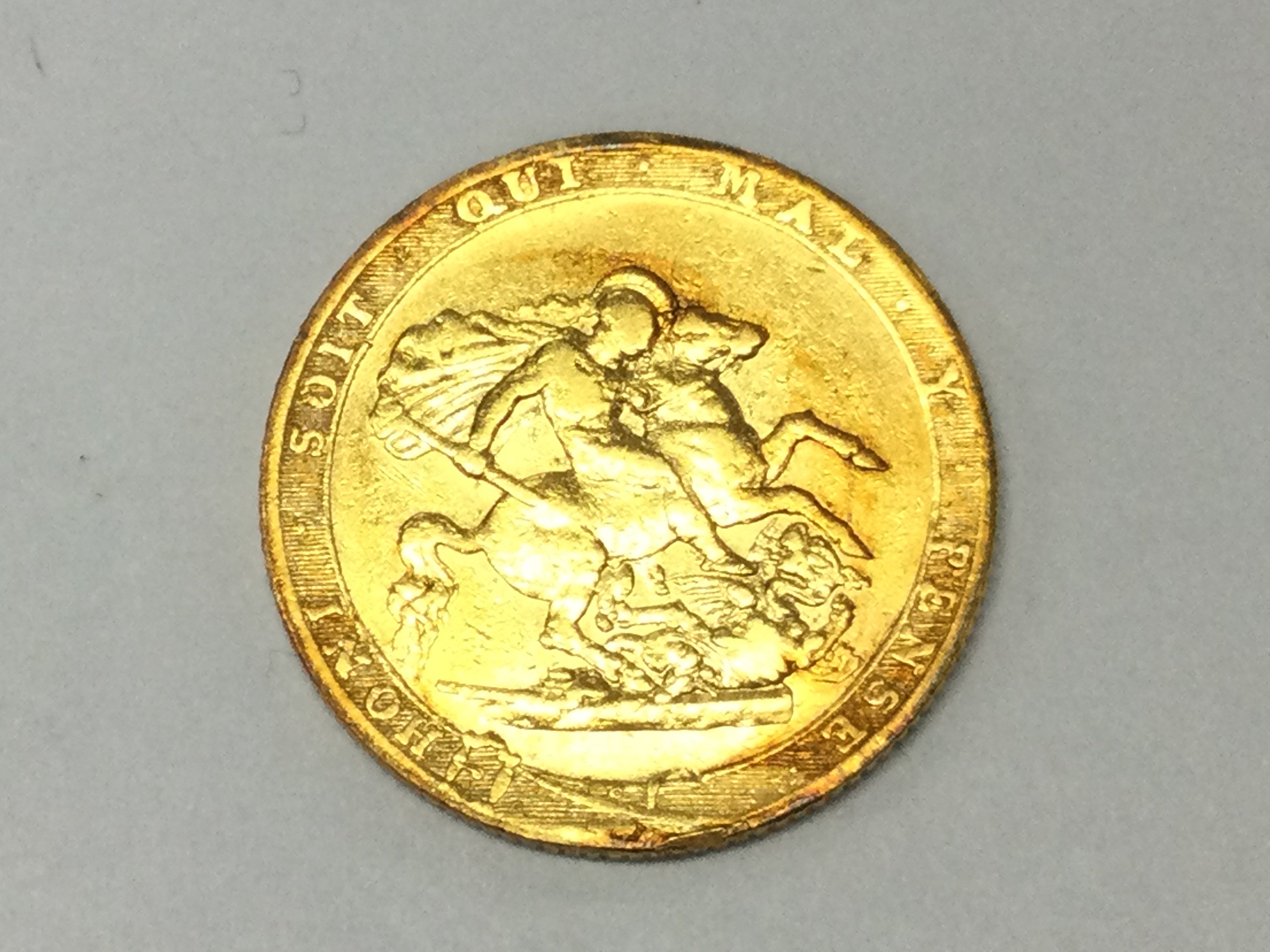 An 1817 full sovereign. First modern sovereign issue. Postage B