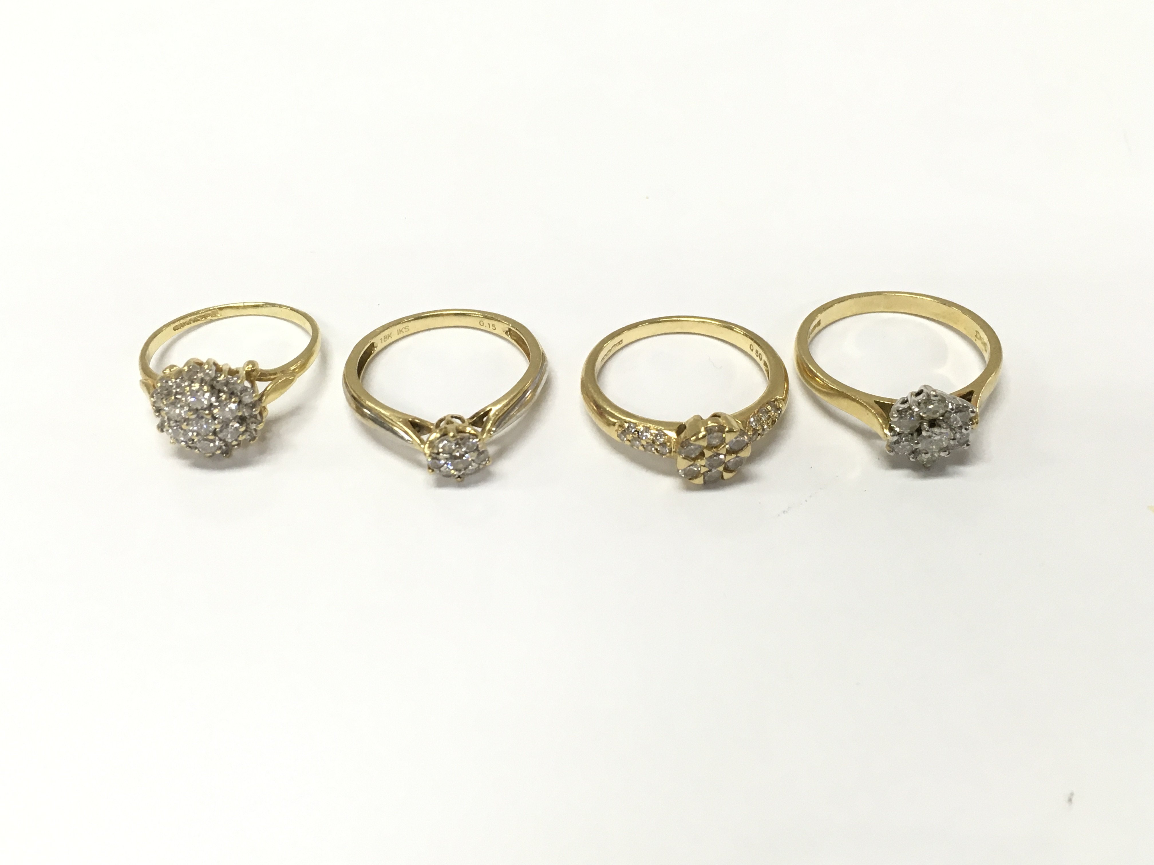 Four 18ct gold diamond cluster rings sizes J1/2 M and N approximately 11.2g