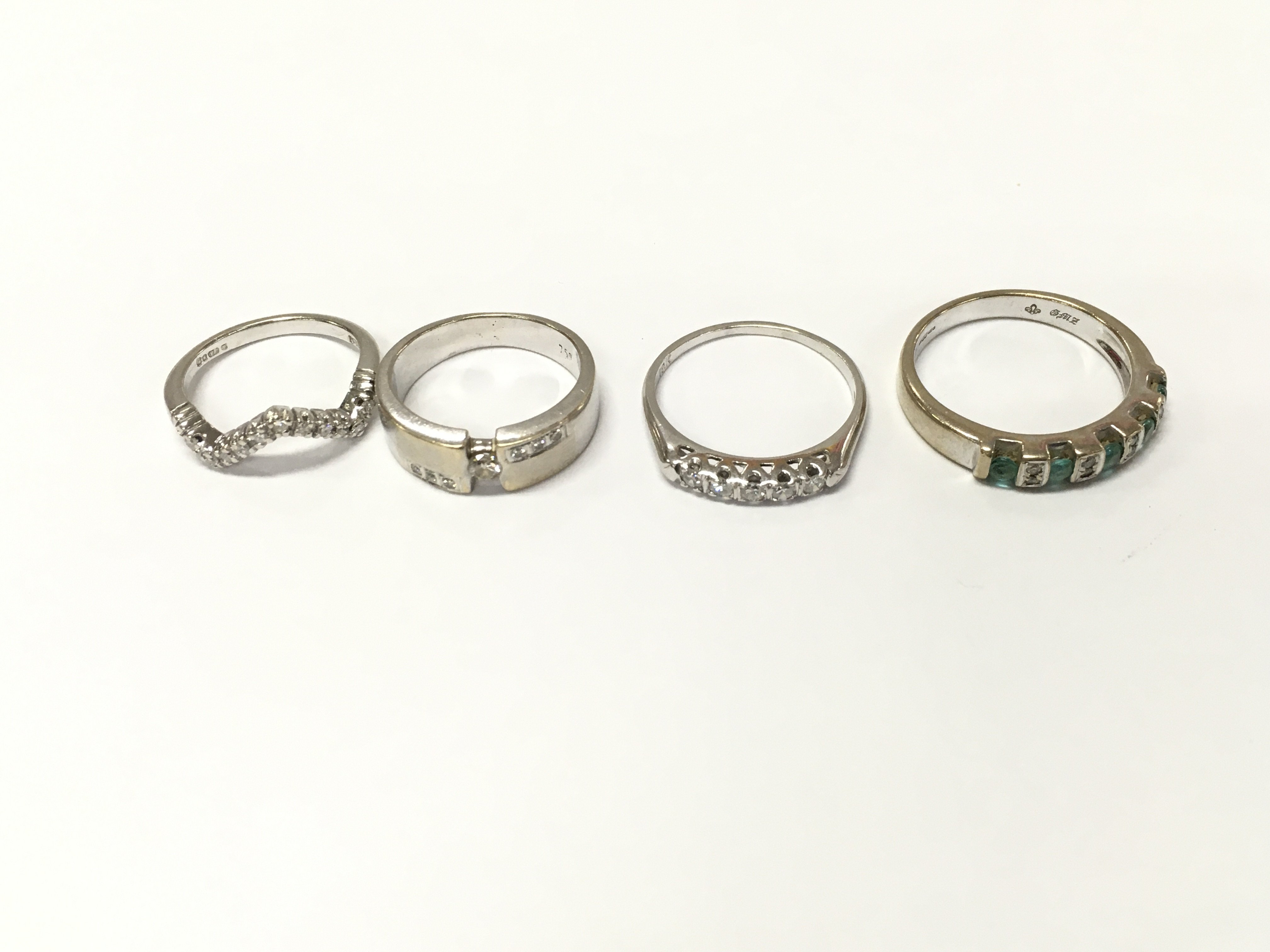Four 18ct white gold diamond and emerald rings sizes K L Q R approximately 16.5g