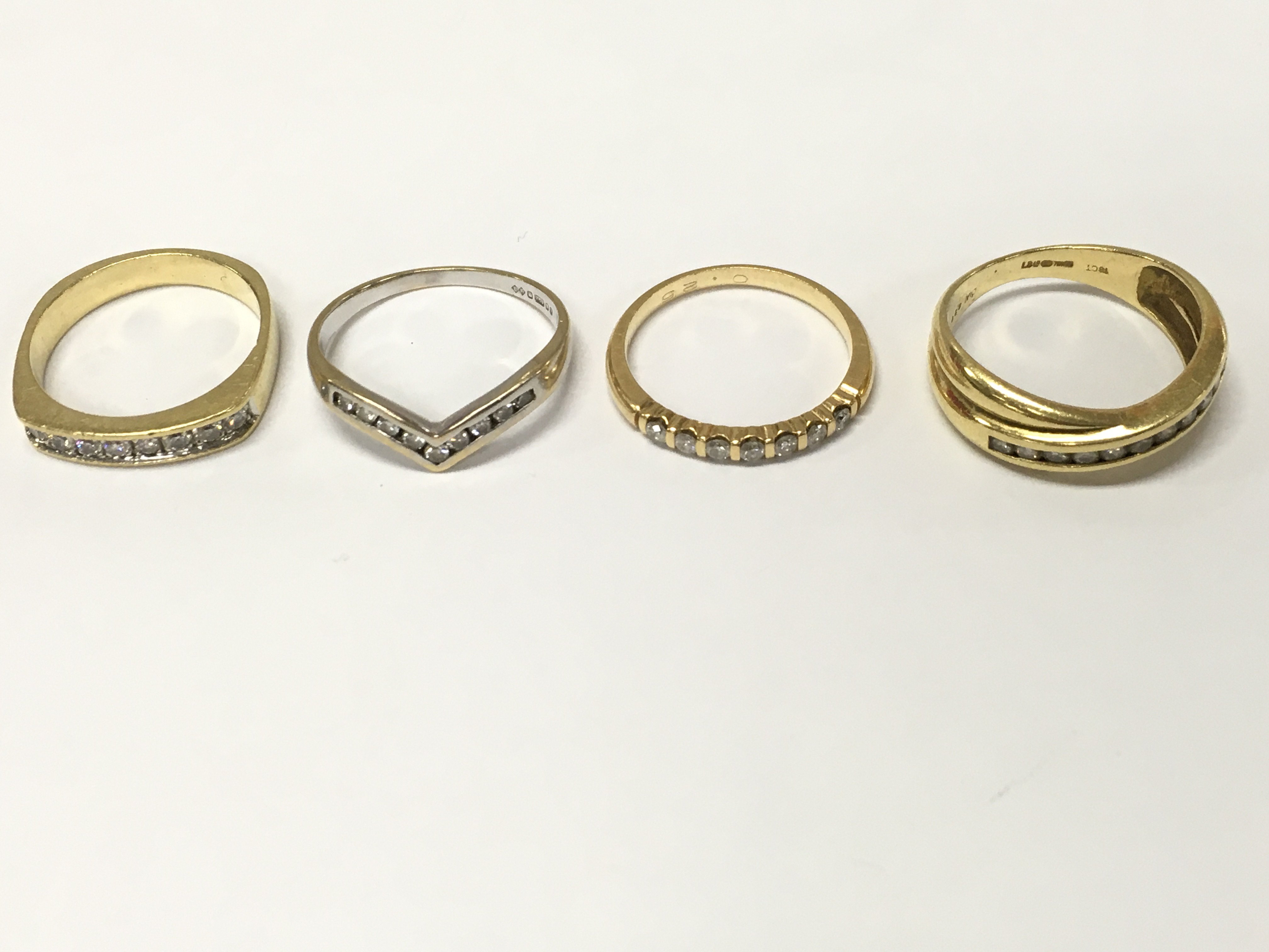 Four 18ct gold diamond half hoop rings. Size L M1/2 O approximately 13.2g