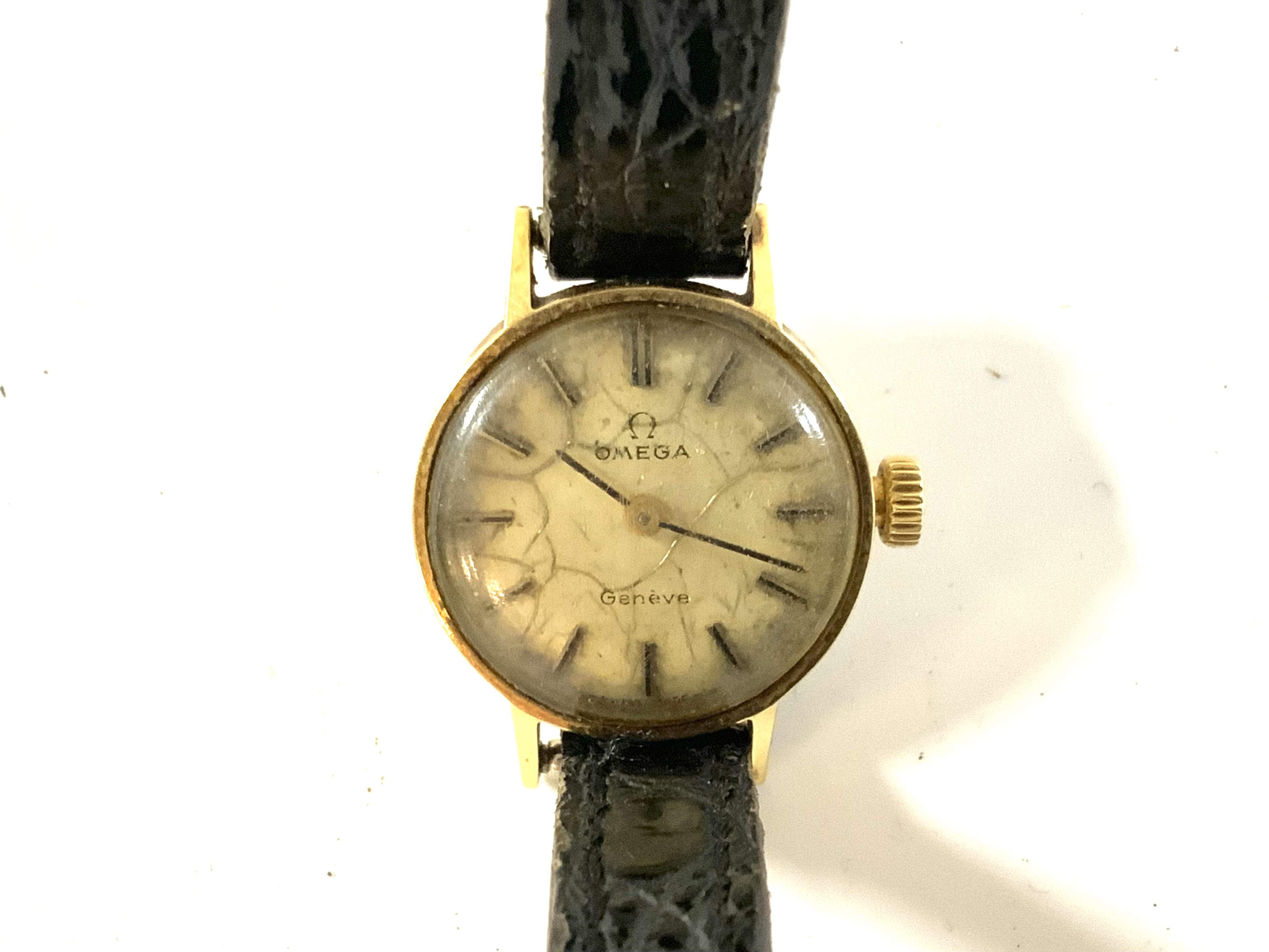 A 14ct gold ladies omega wristwatch.