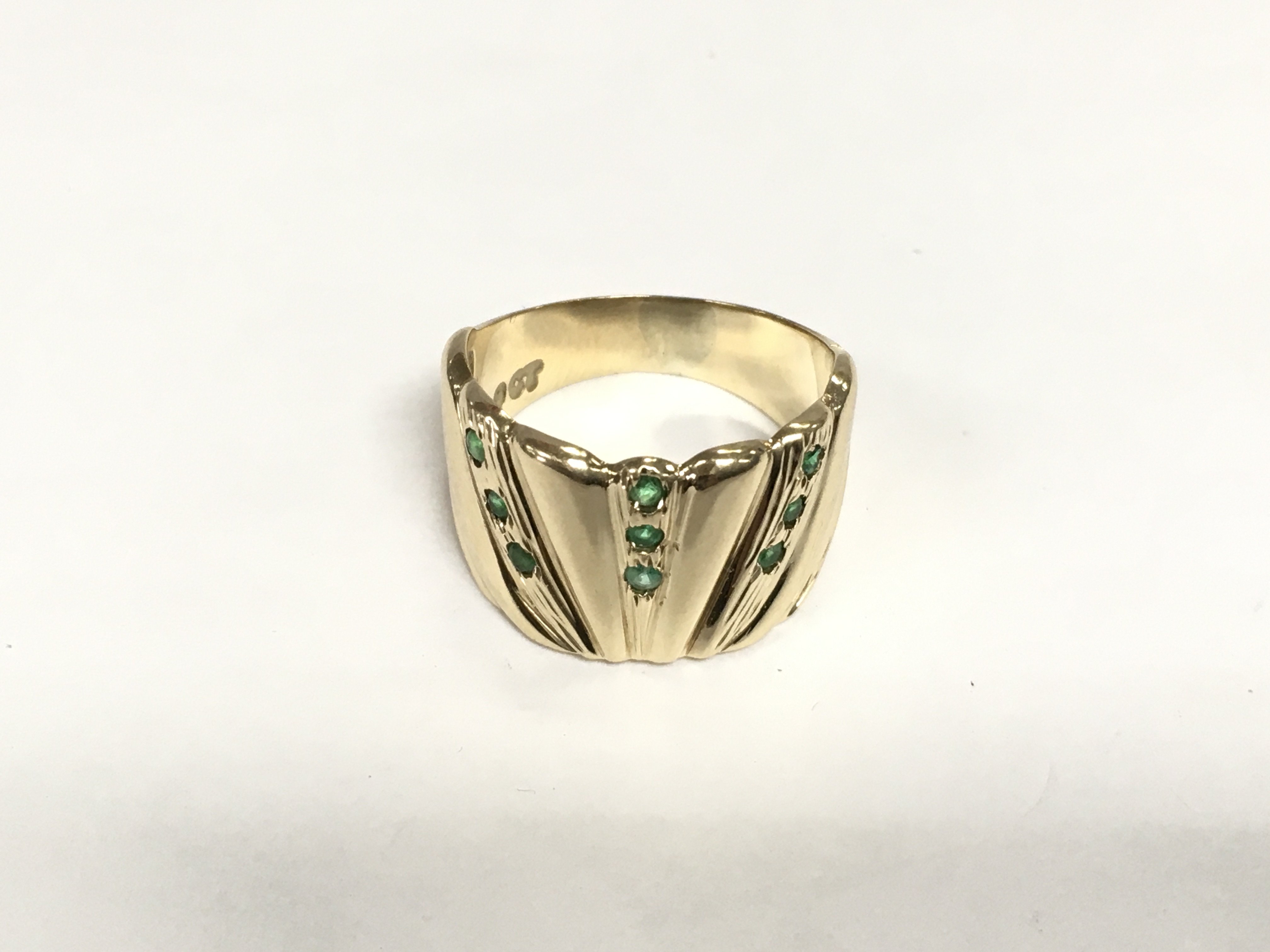 A 9ct gold and emerald dress ring, approx 5.3g and approx size M-N. Shipping category A.