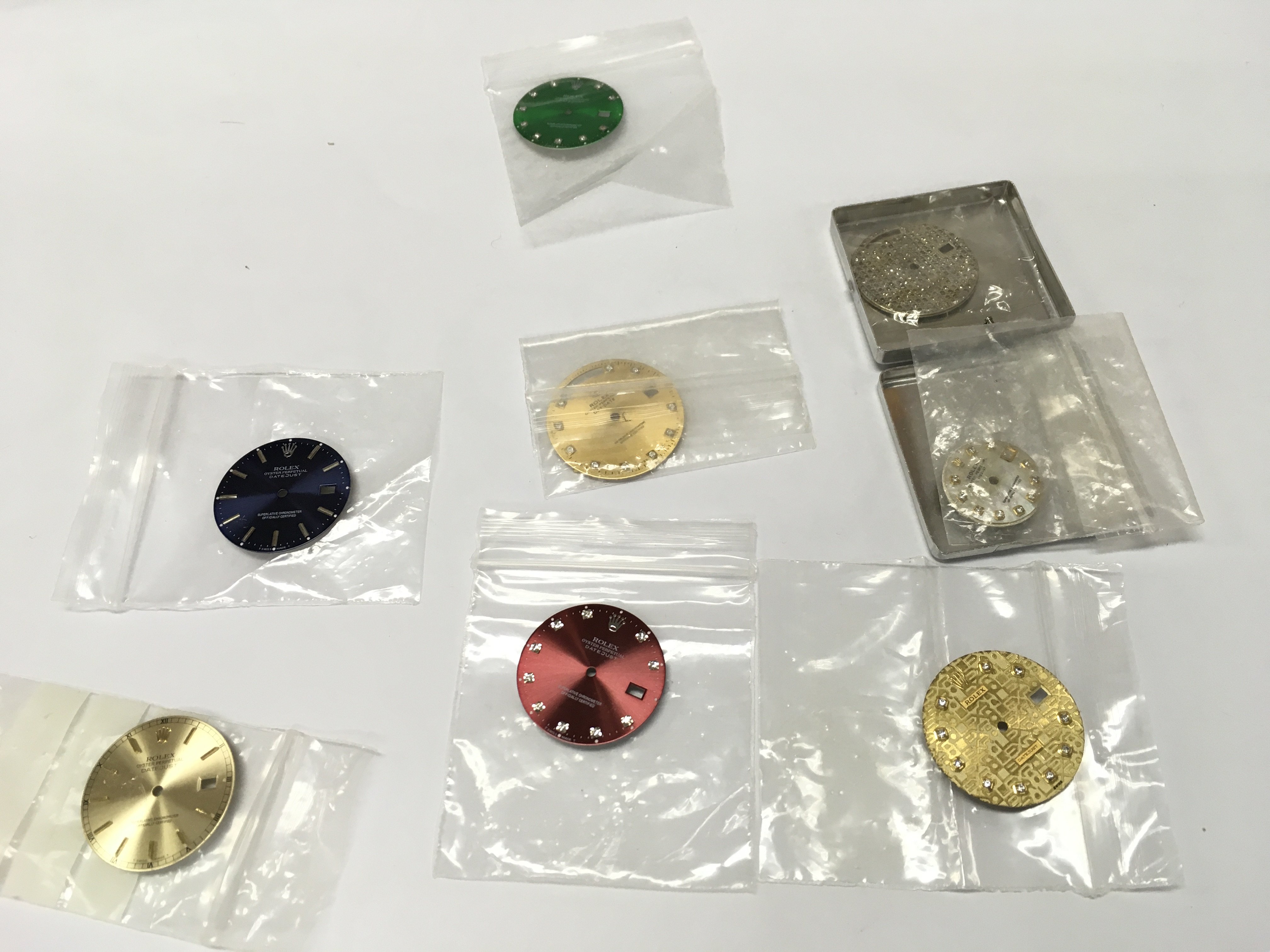 A collection of assorted rolex dials including diamond set for day date and date just. Buyer to satisfy themselves with authenticity prior to bidding.