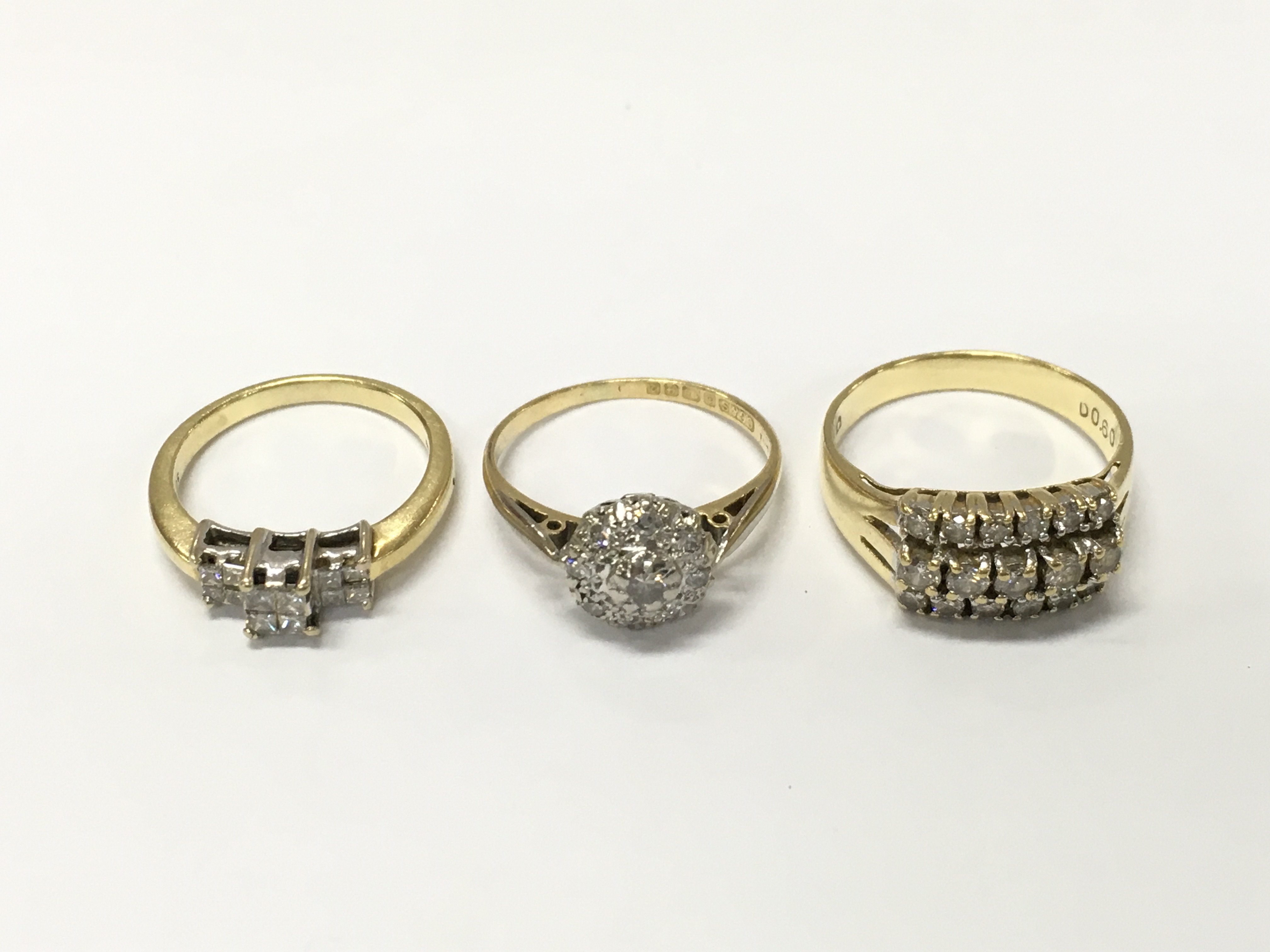 Three 18ct gold diamond cluster rings. Sizes I K1/2 and M approximately 9g