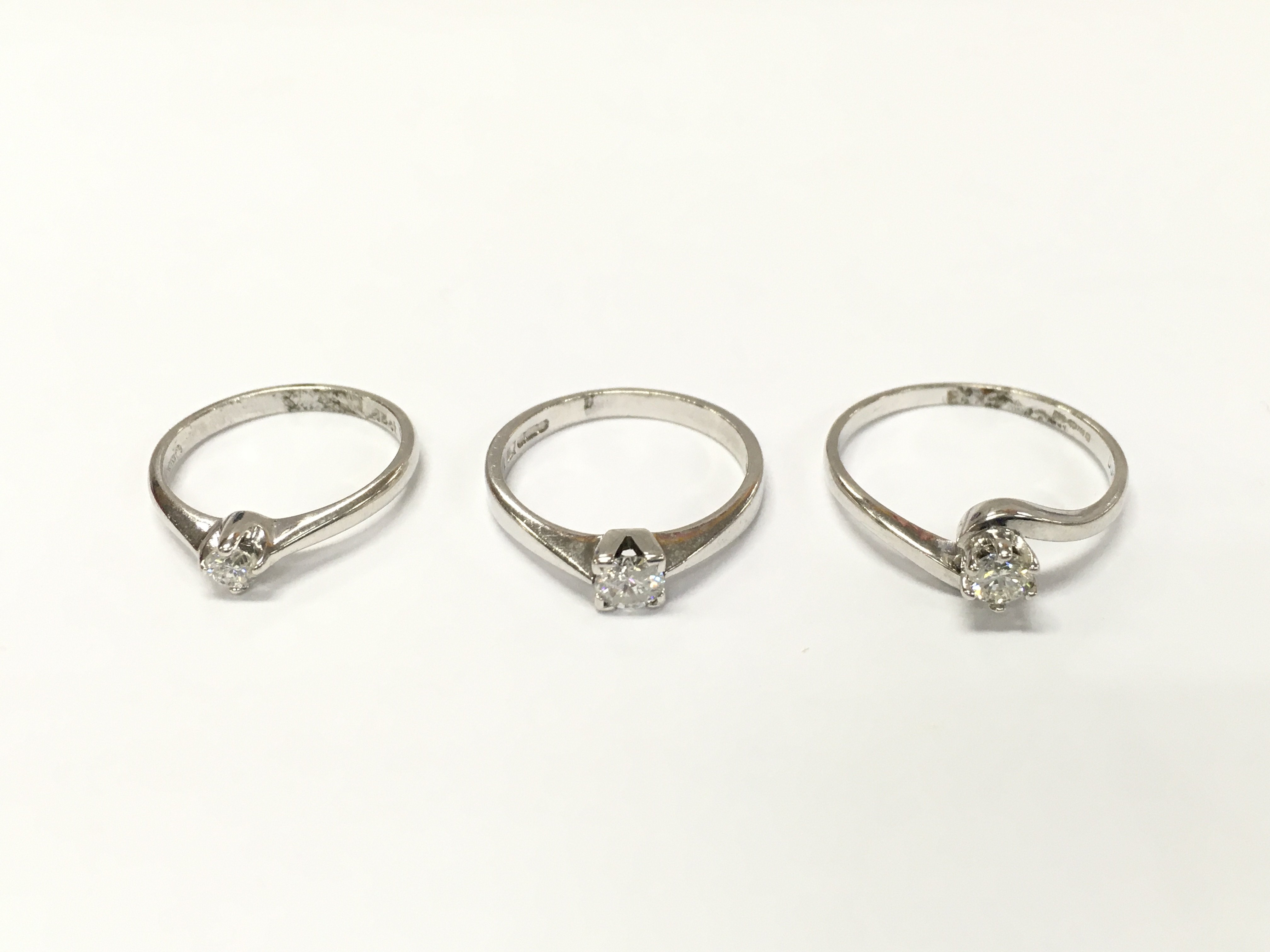 Three 18ct white gold diamond solitaire rings. Sizes J L and P approximately 7.6g