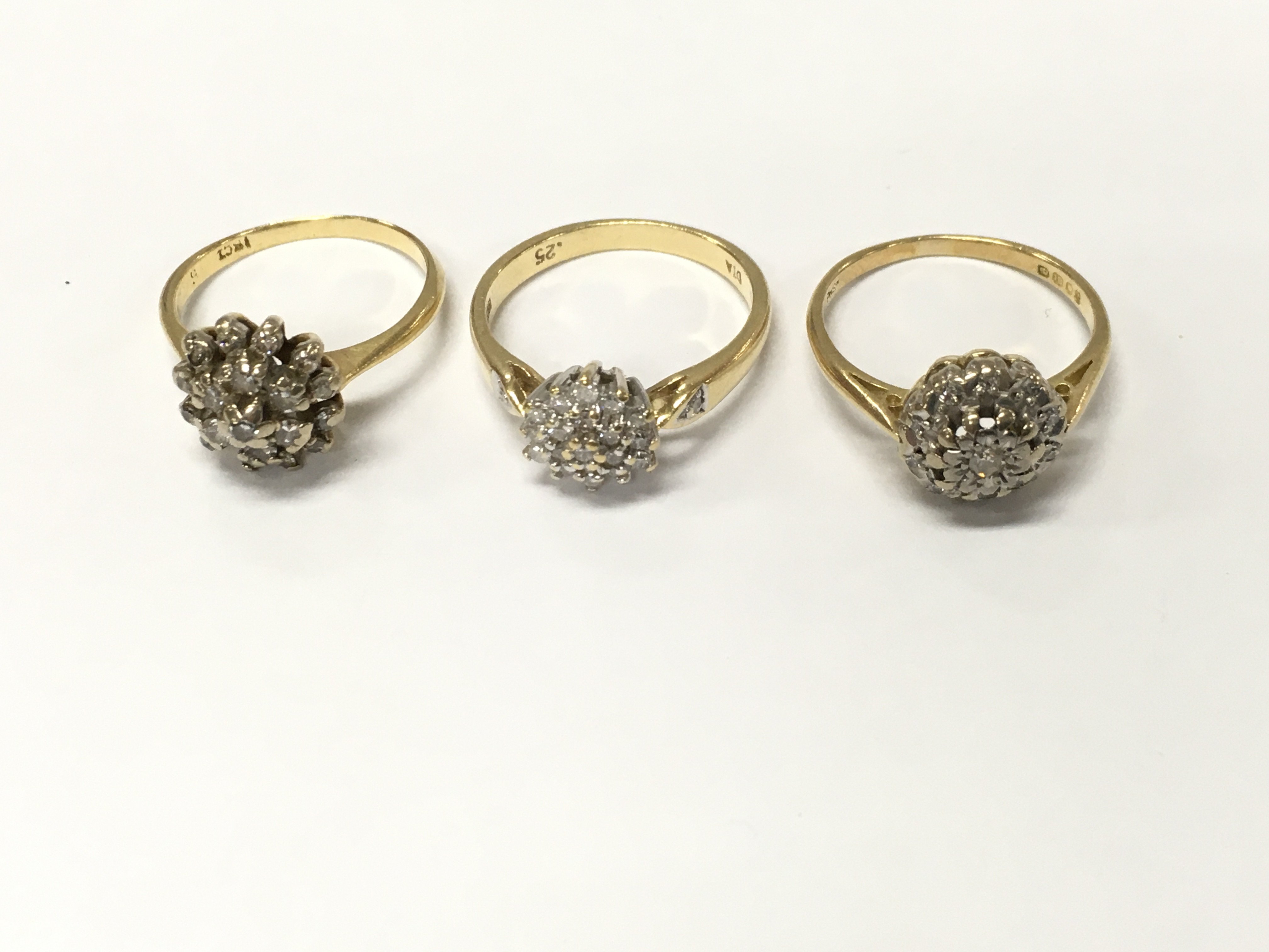 Three 18ct gold diamond cluster rings. Sizes J L and approximately 9.5g