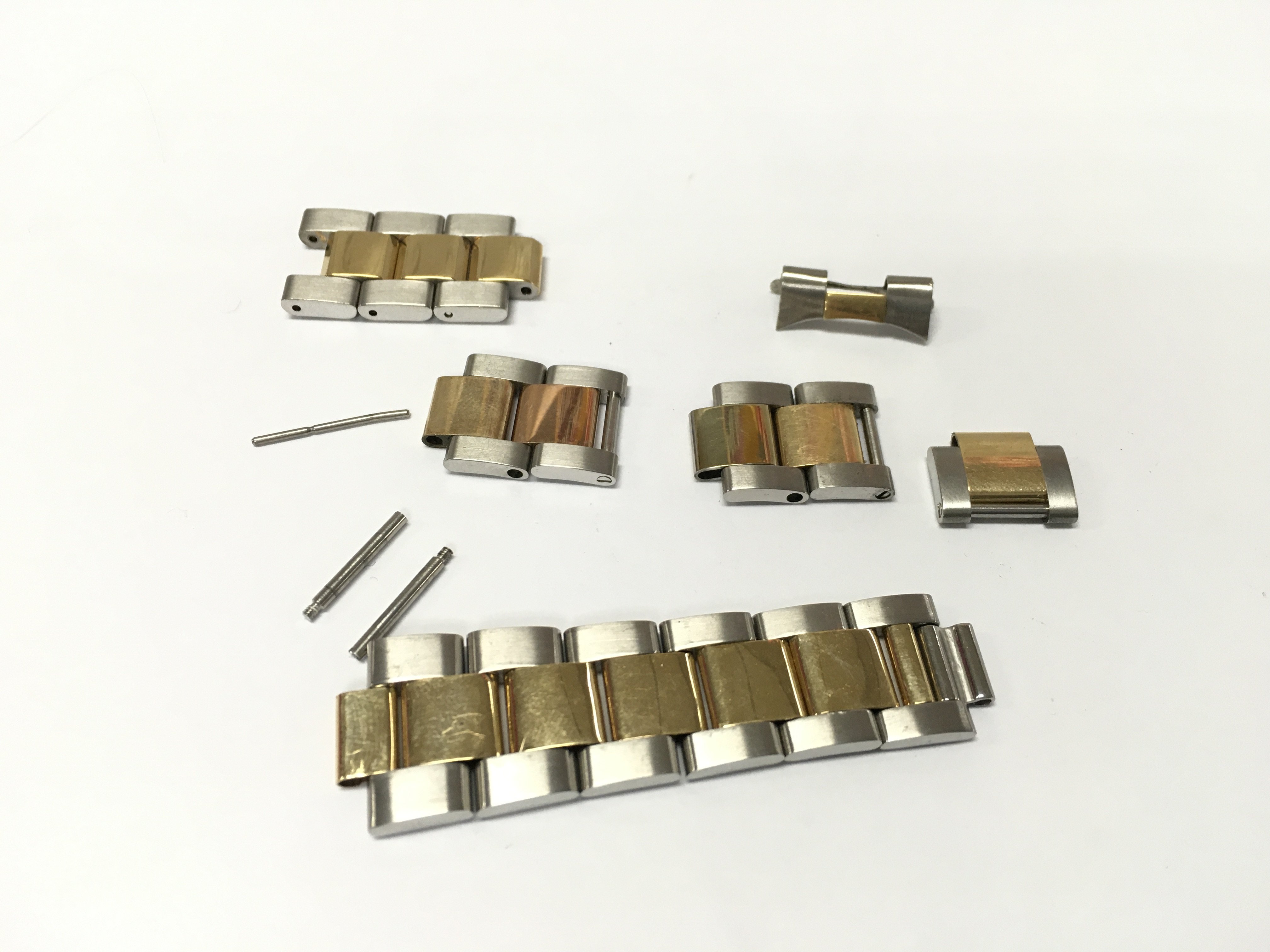 An assorted collection of bi metal links rolex style. Buyer to satisfy themselves with authenticity prior to bidding.