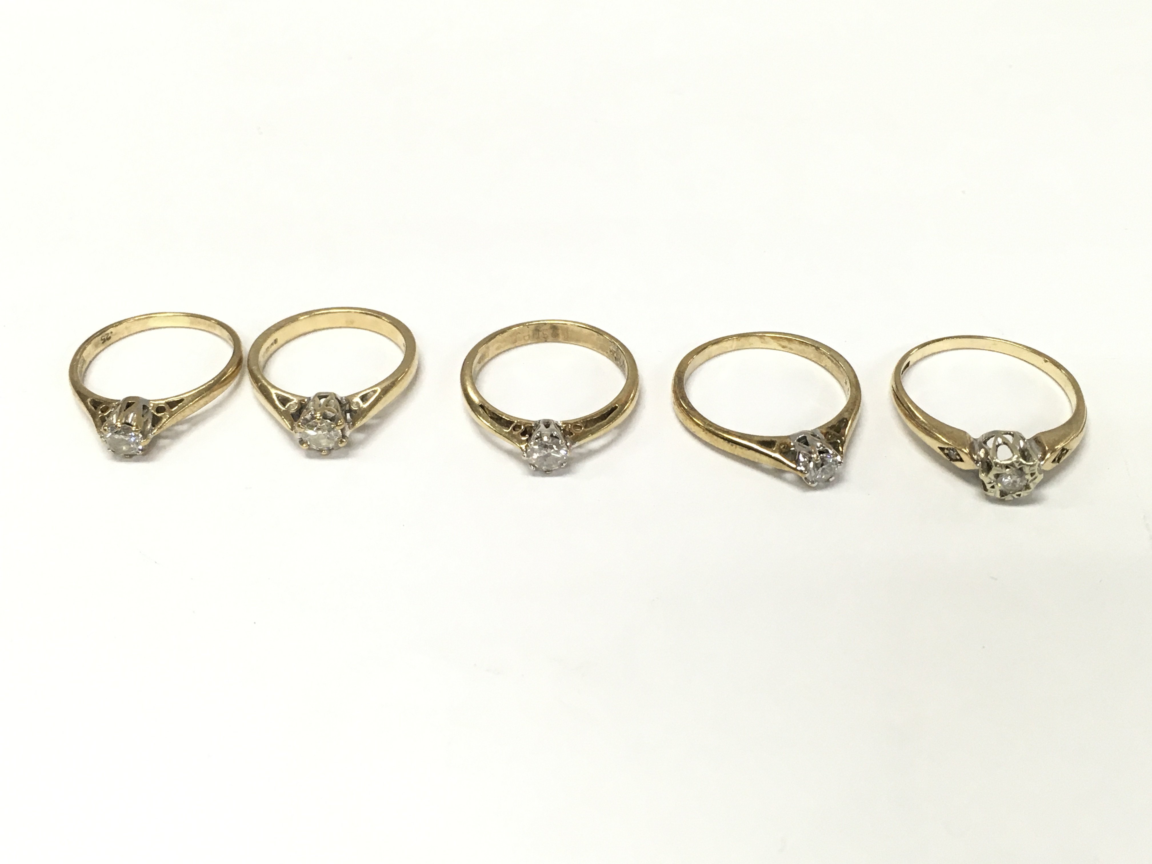 Five 9ct gold diamond solitaire rings. Sizes I K K1/2 M and P approximately 9.7g