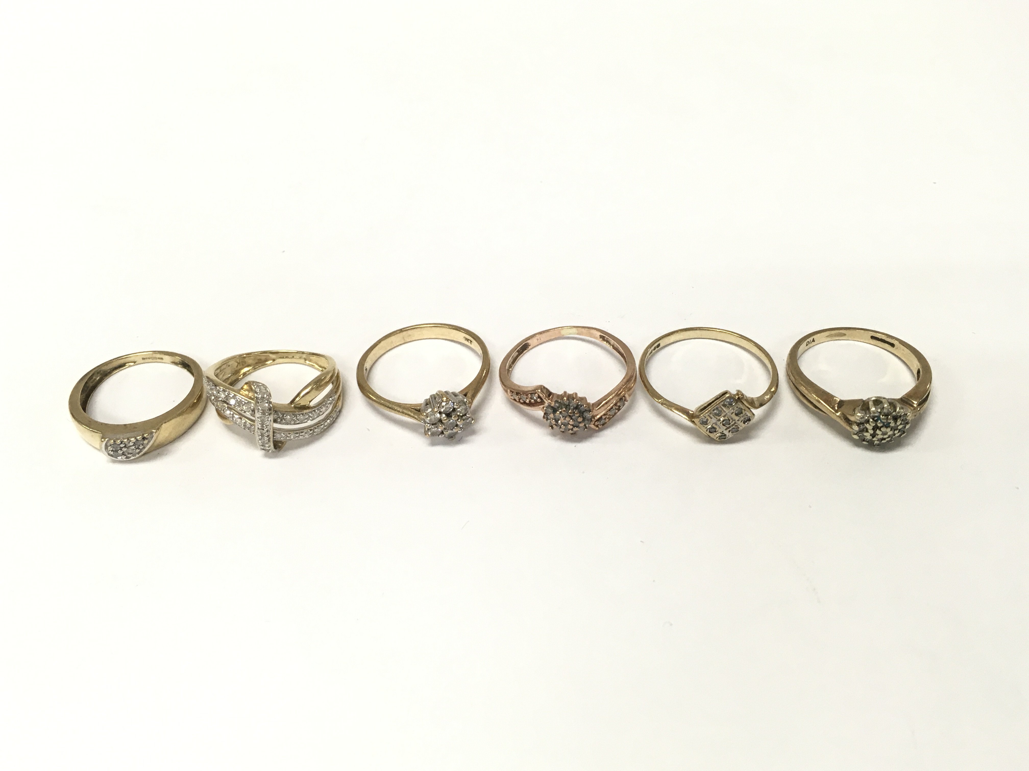 Six 9ct gold diamond cluster rings. Sizes H1/2 I1/2 K M O approximately 11.7g