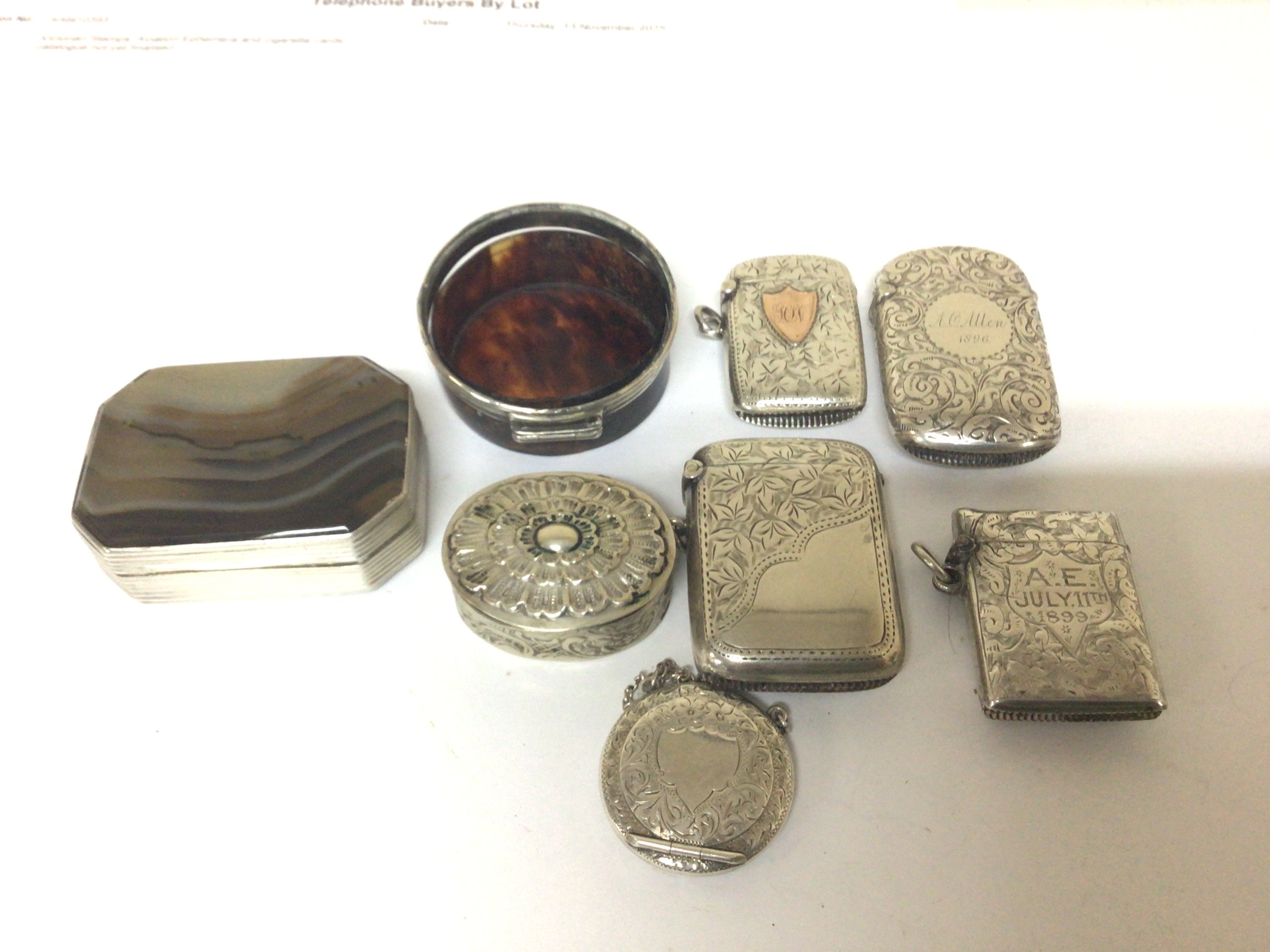 A collection of silver Vesta cases a polished George III silver and agate box (damaged) and others