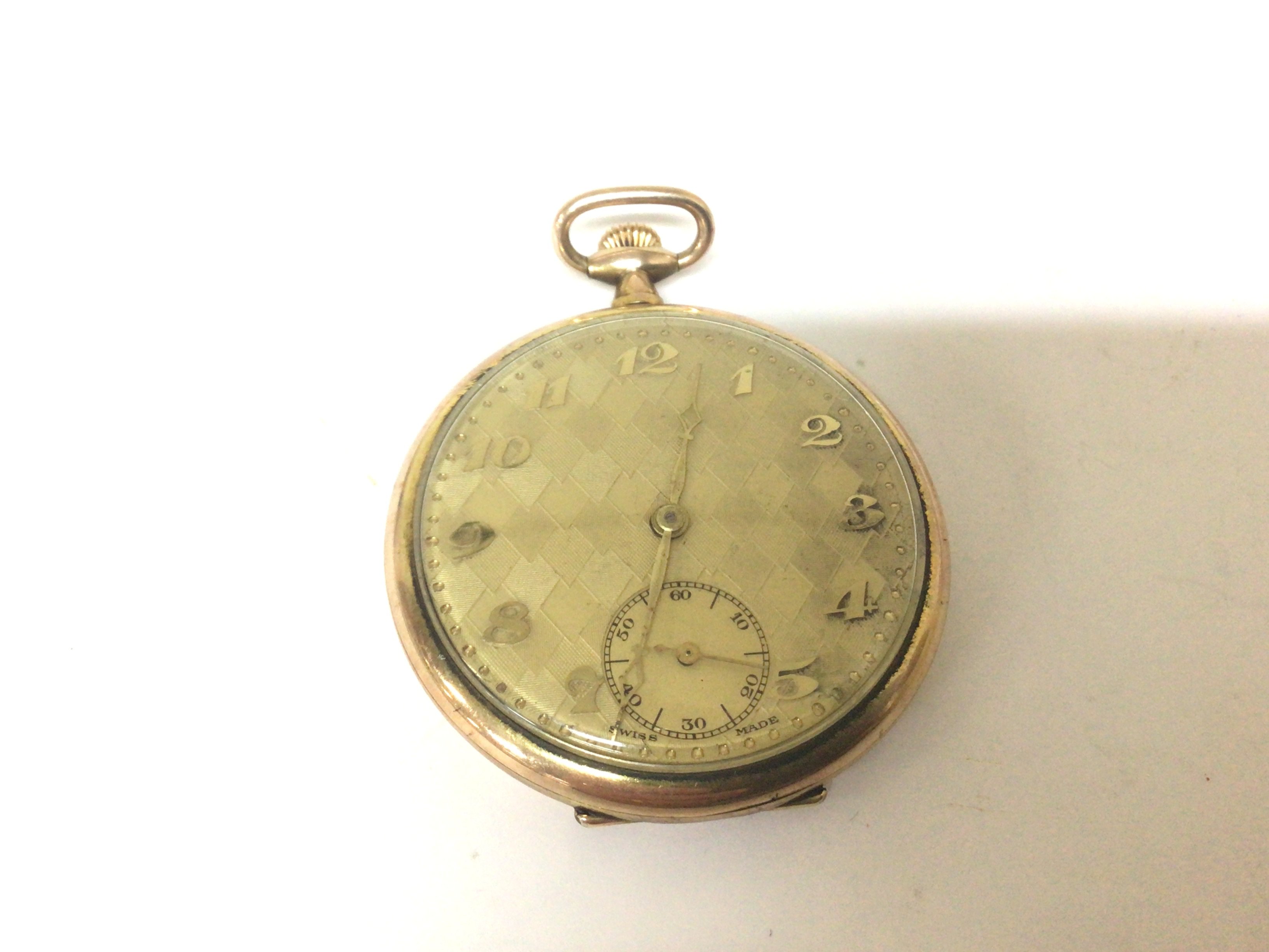 A Gold plated button wind pocket watch with Arabic numerals not seen working.