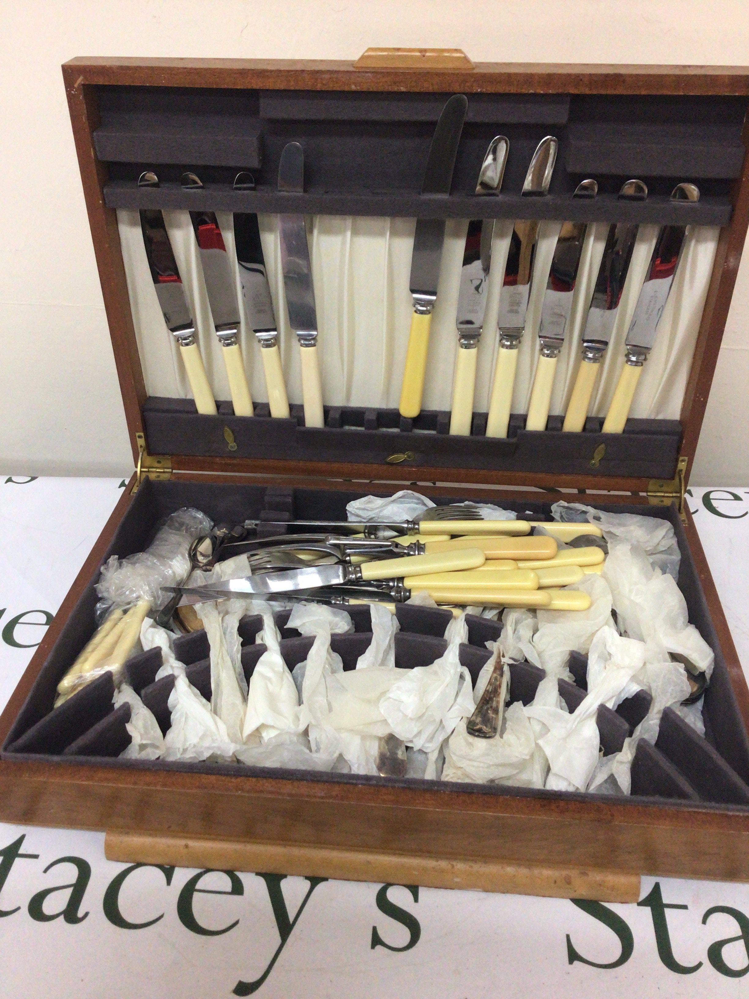 A Maple Wood Canteen of mixed Cutlery in a fitted case.