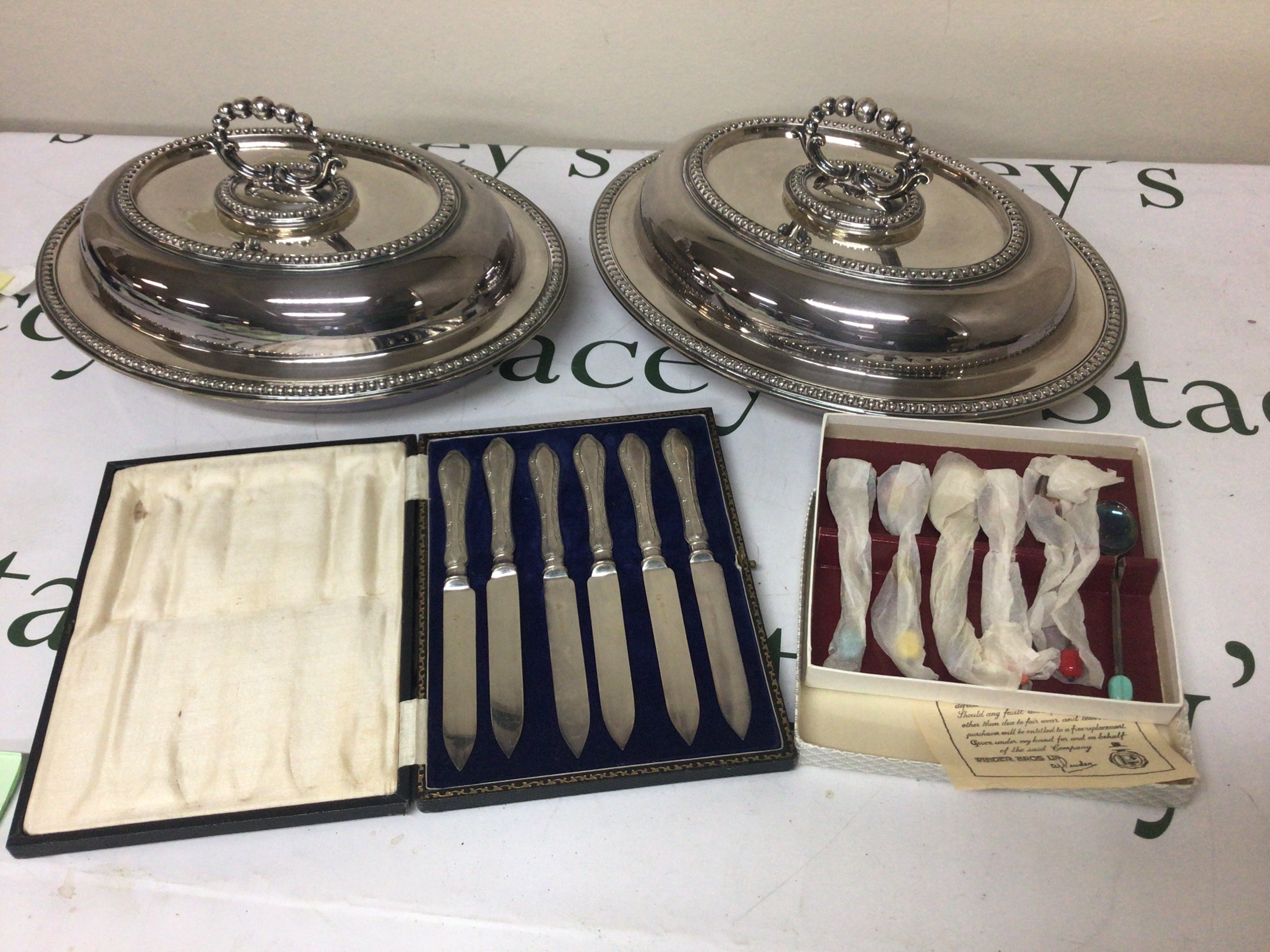A pair of oval silver plated vegetable dishes cased cutlery and loose king pattern silver plated cutlery and other oddments.