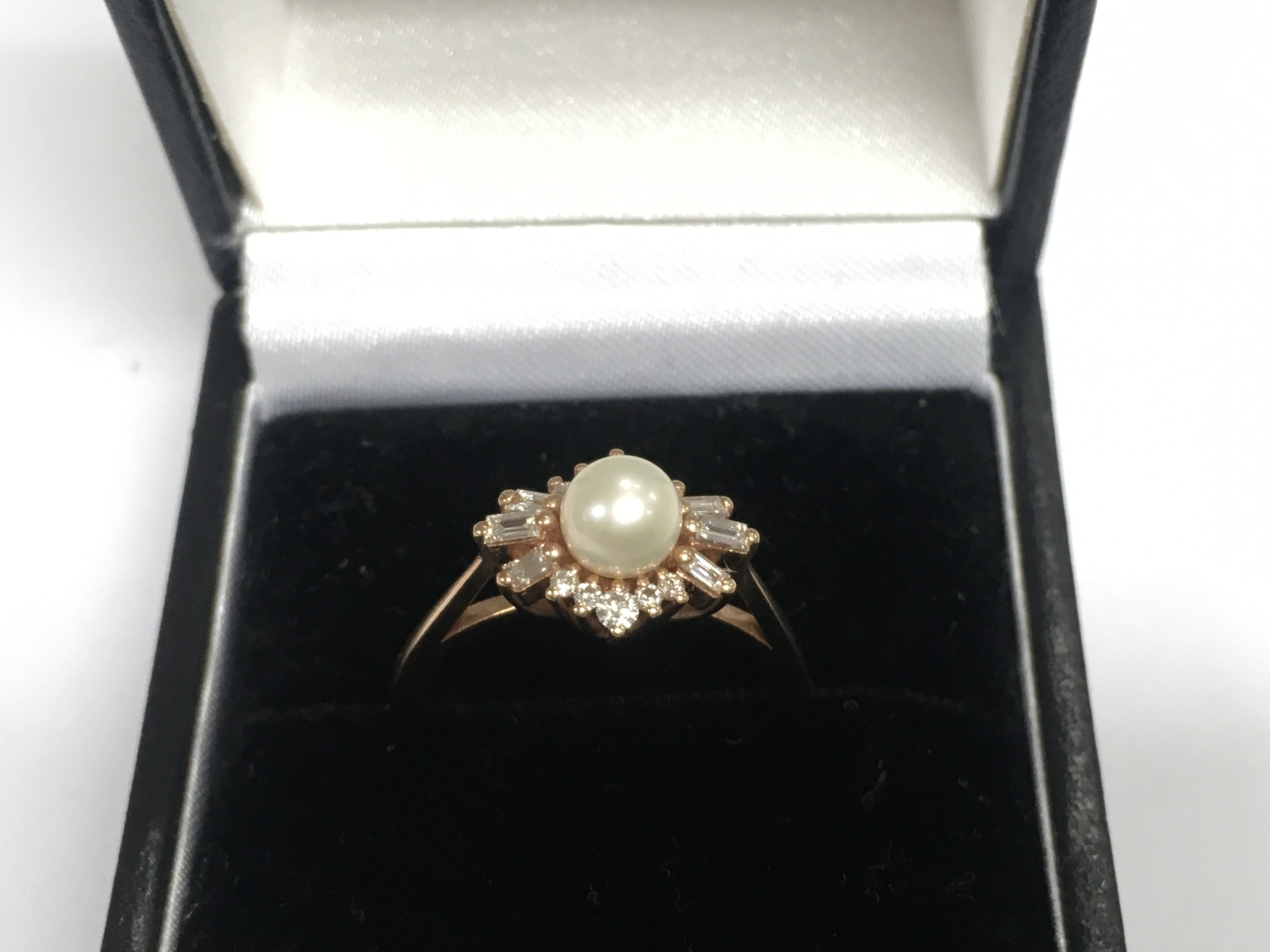 A 14ct rose gold diamond and pearl ring, approx 3g and approx size M. Shipping category A.