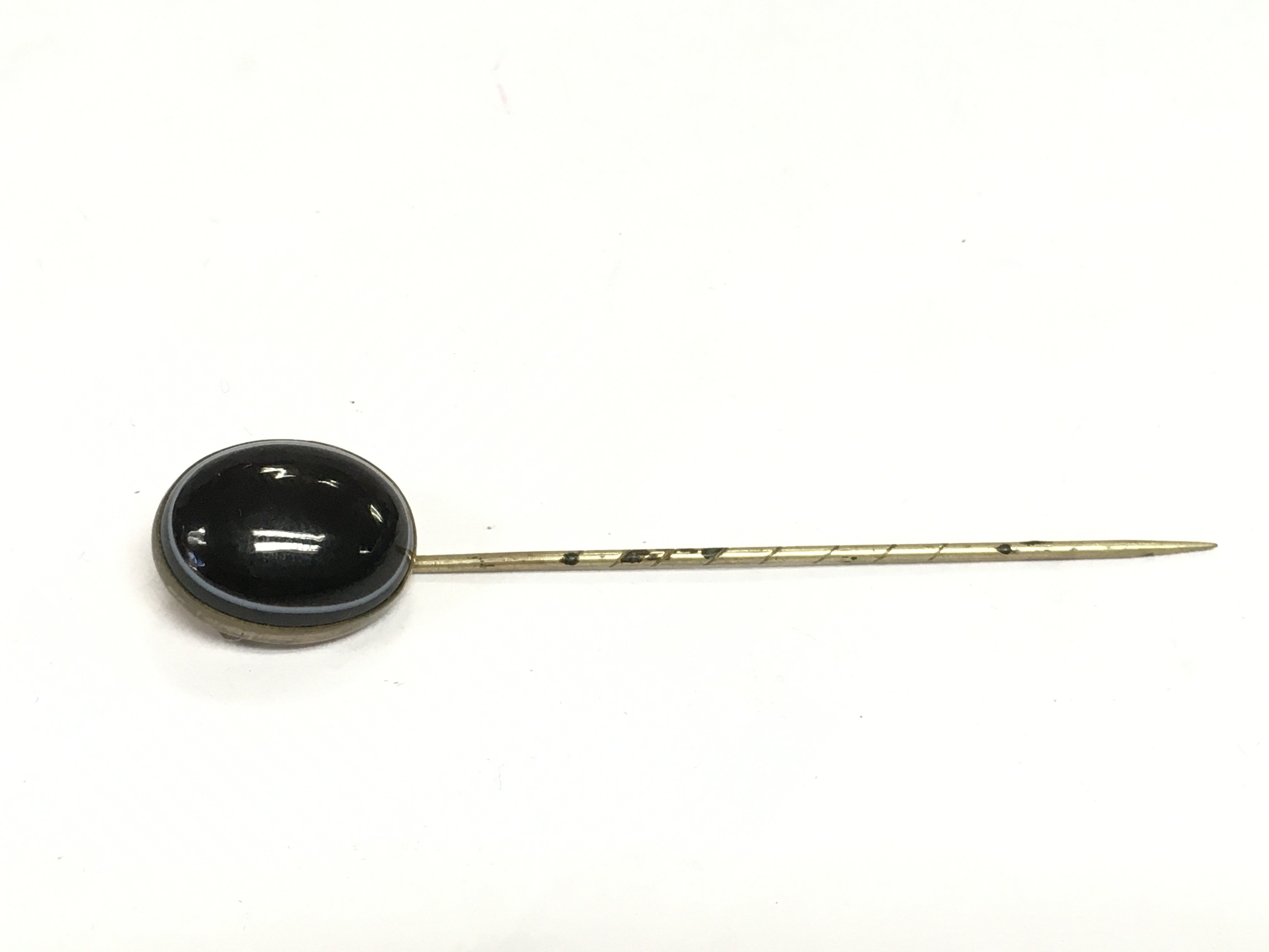 A banded agate stick pin. Shipping category A.