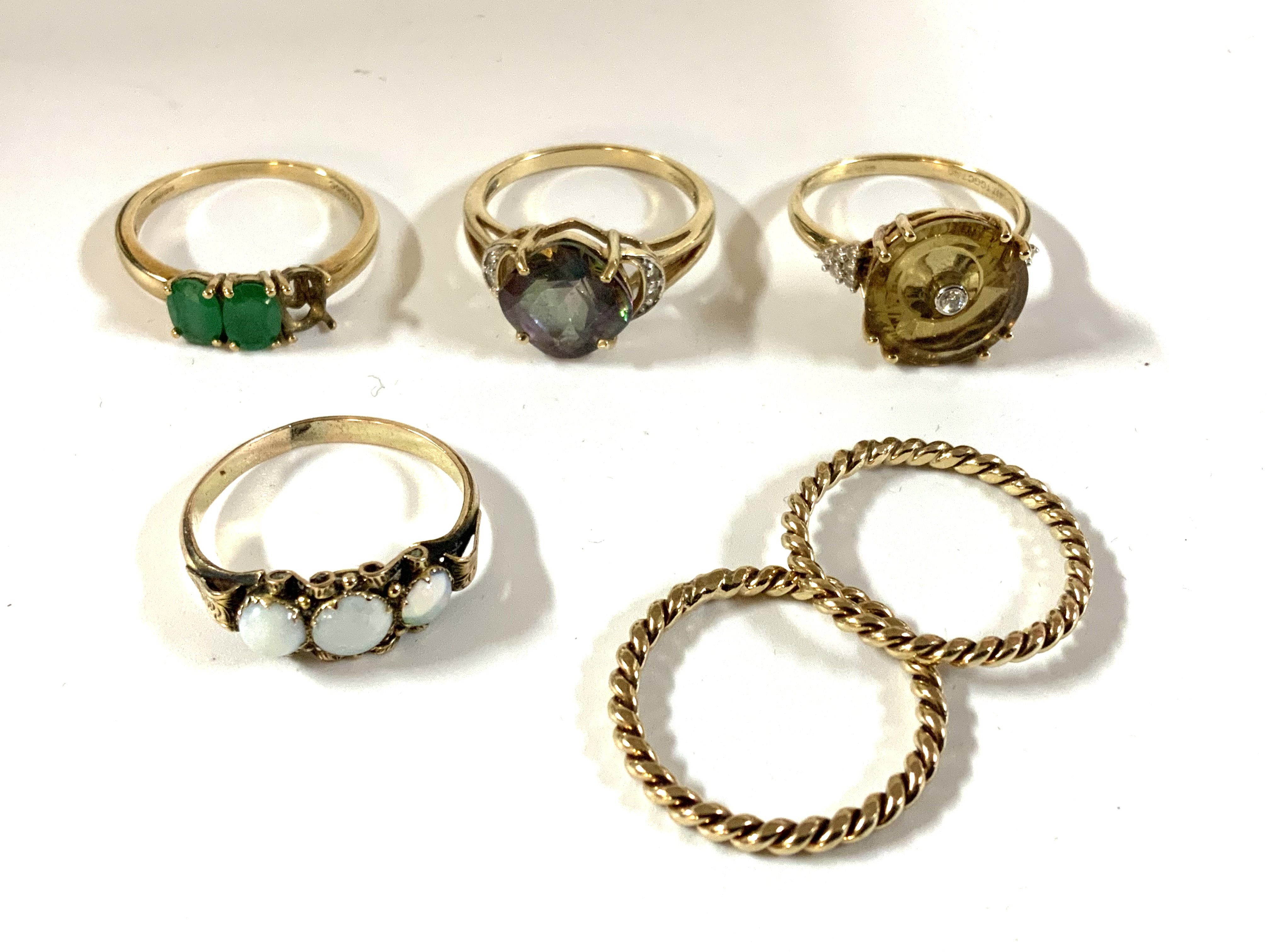 A small collection of 9ct gold and stone set rings. (A)