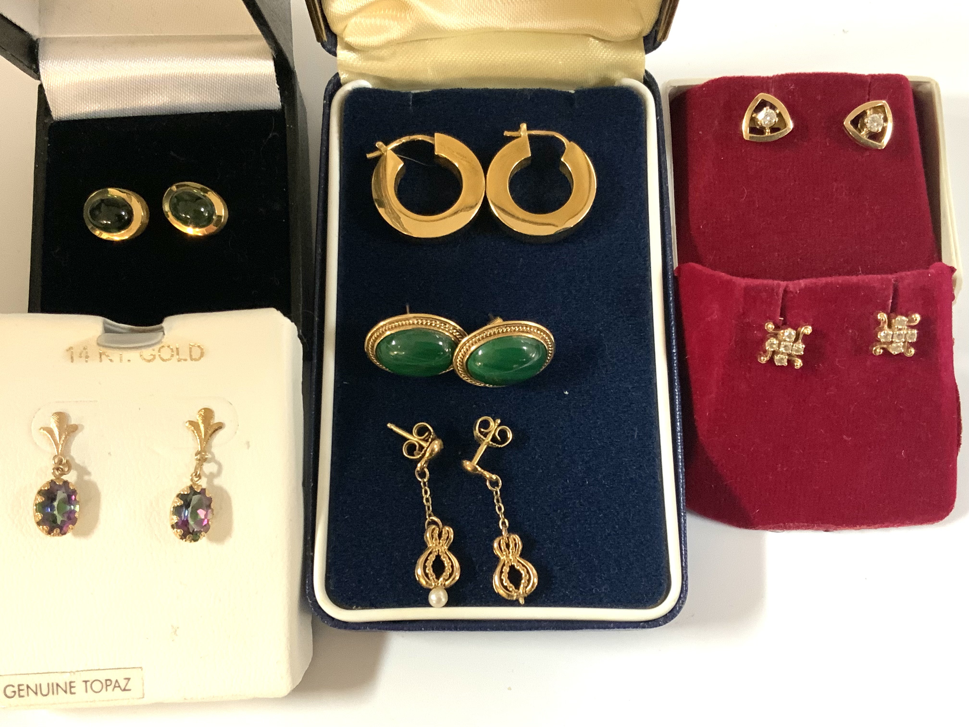7 pairs of gold and stone set earrings. (A)