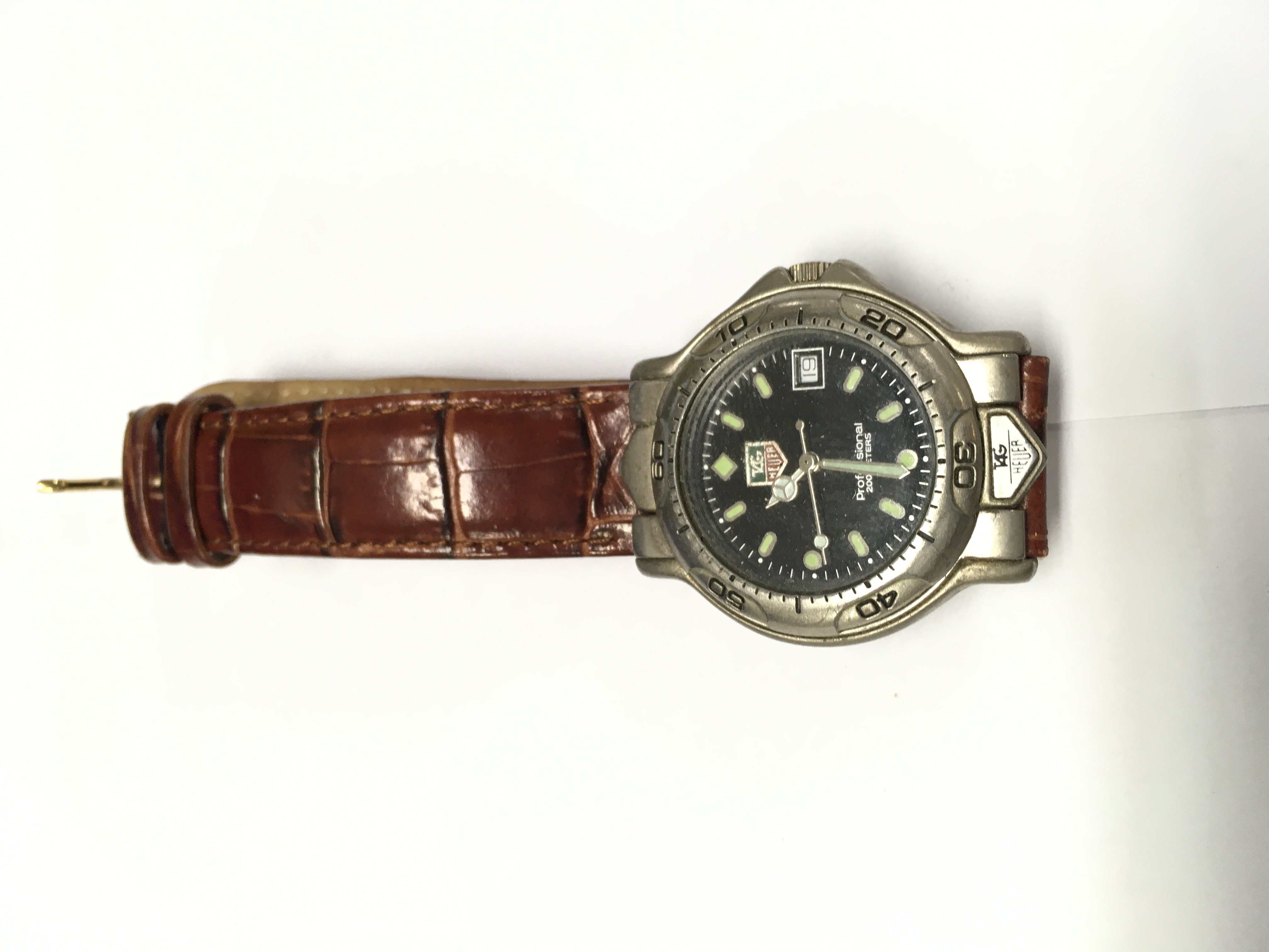 A vintage gents Tag Heuer watch.