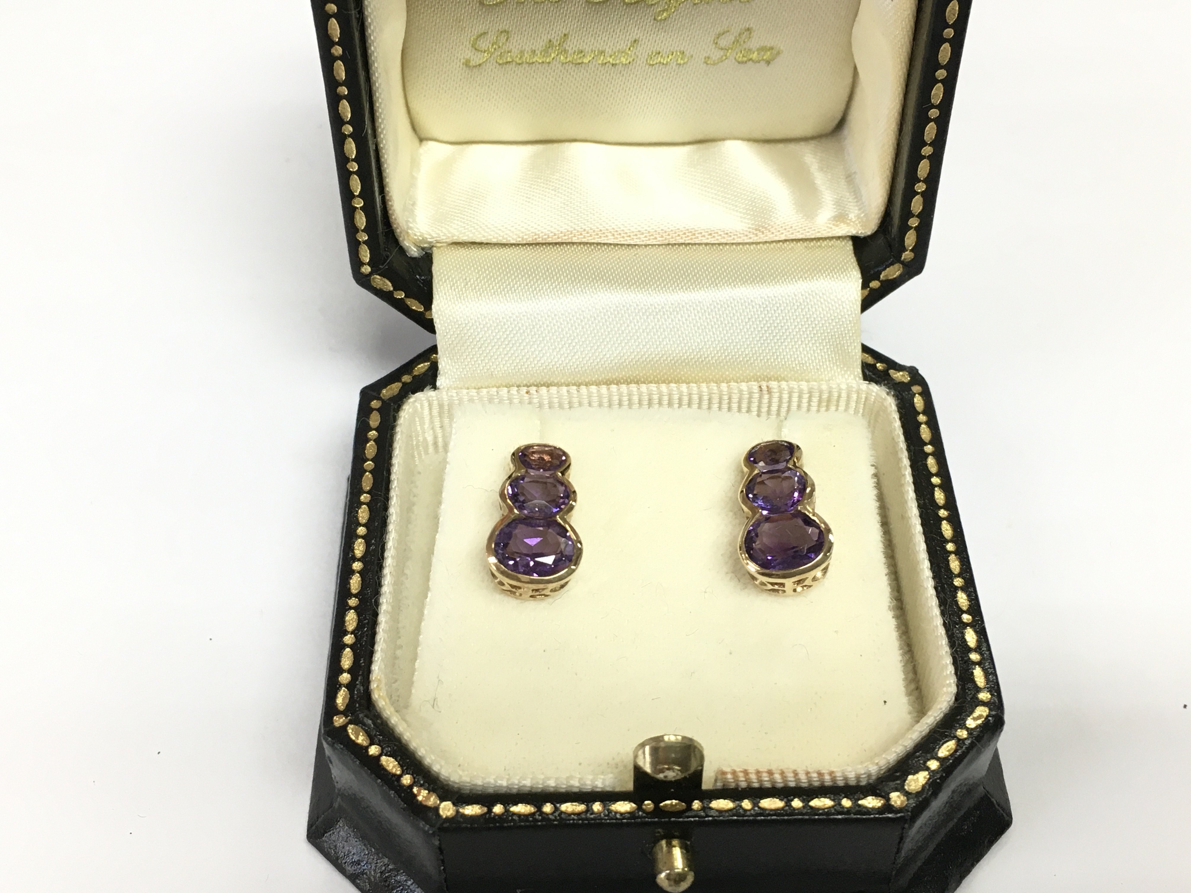 A pair of 9ct gold and amethyst earrings, approx 2.5g. Shipping category A.