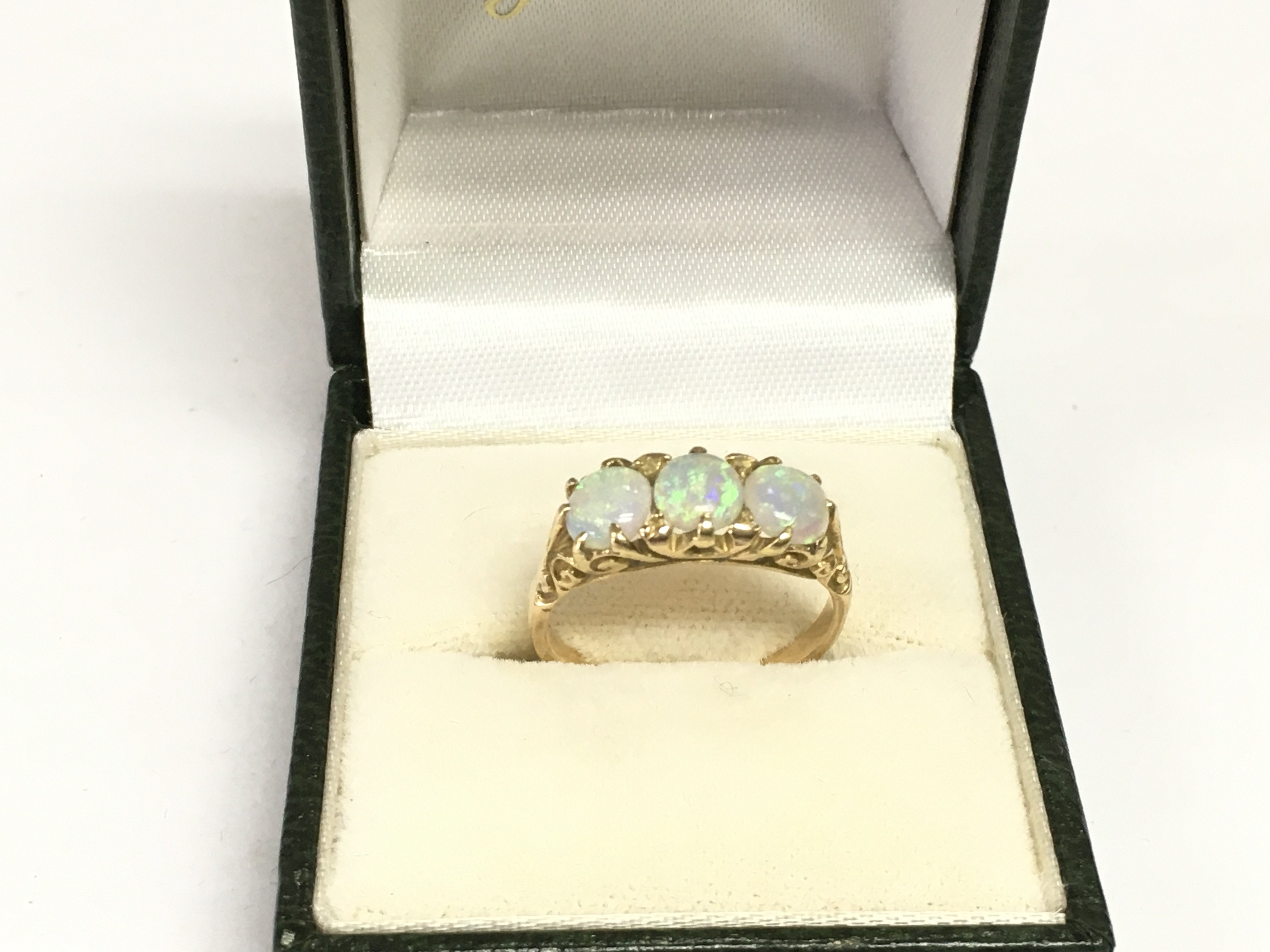A gold and opal ring, tested at 14k, approx 3.4g and approx size M-N. Shipping category A.