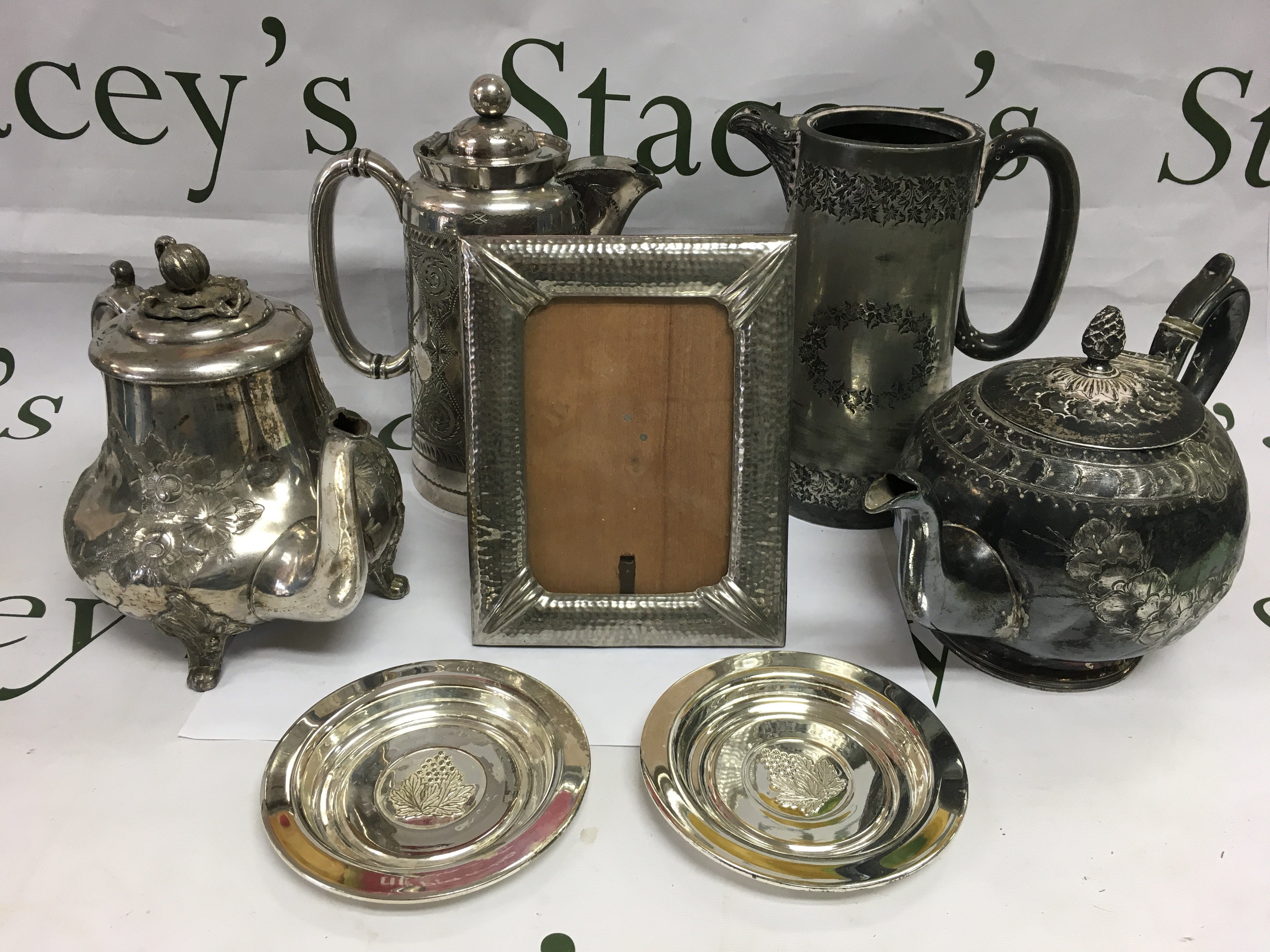 A collection of silver plated items comprising tea and coffee service items, cutlery etc. Shipping category D.