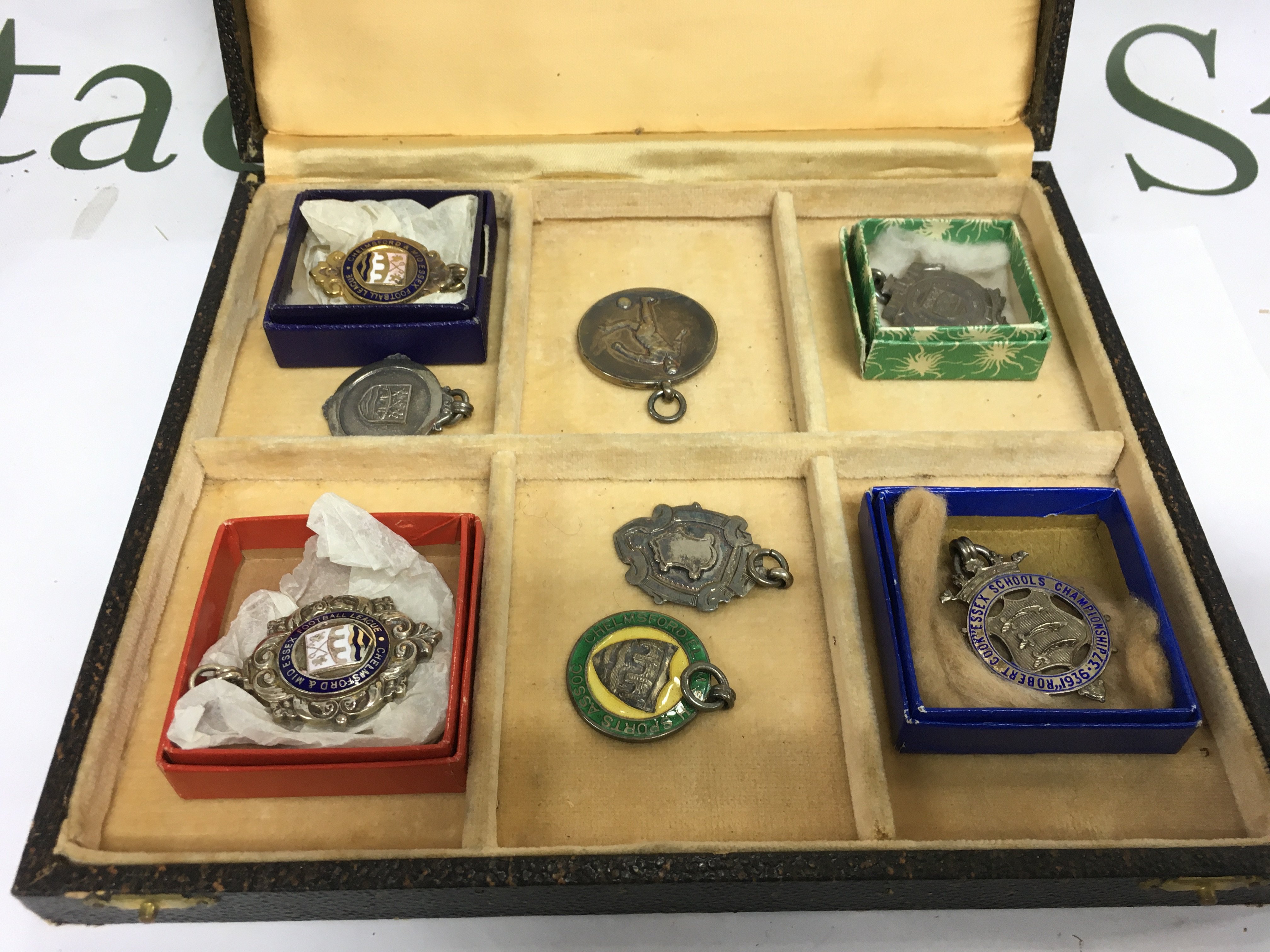 A collection of silver pendants. Shipping category B.