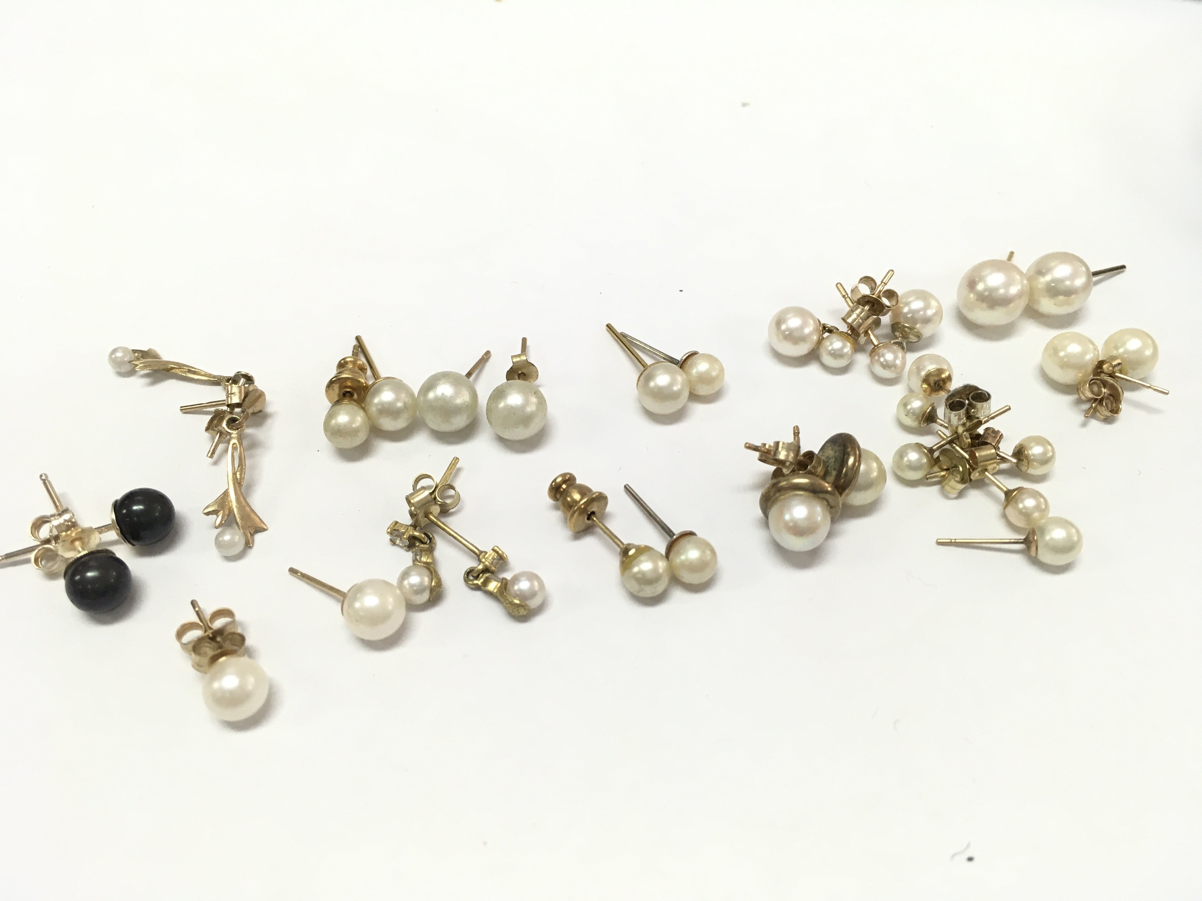 9ct gold Pearl earrings 13g total weight approximately . Postage category A