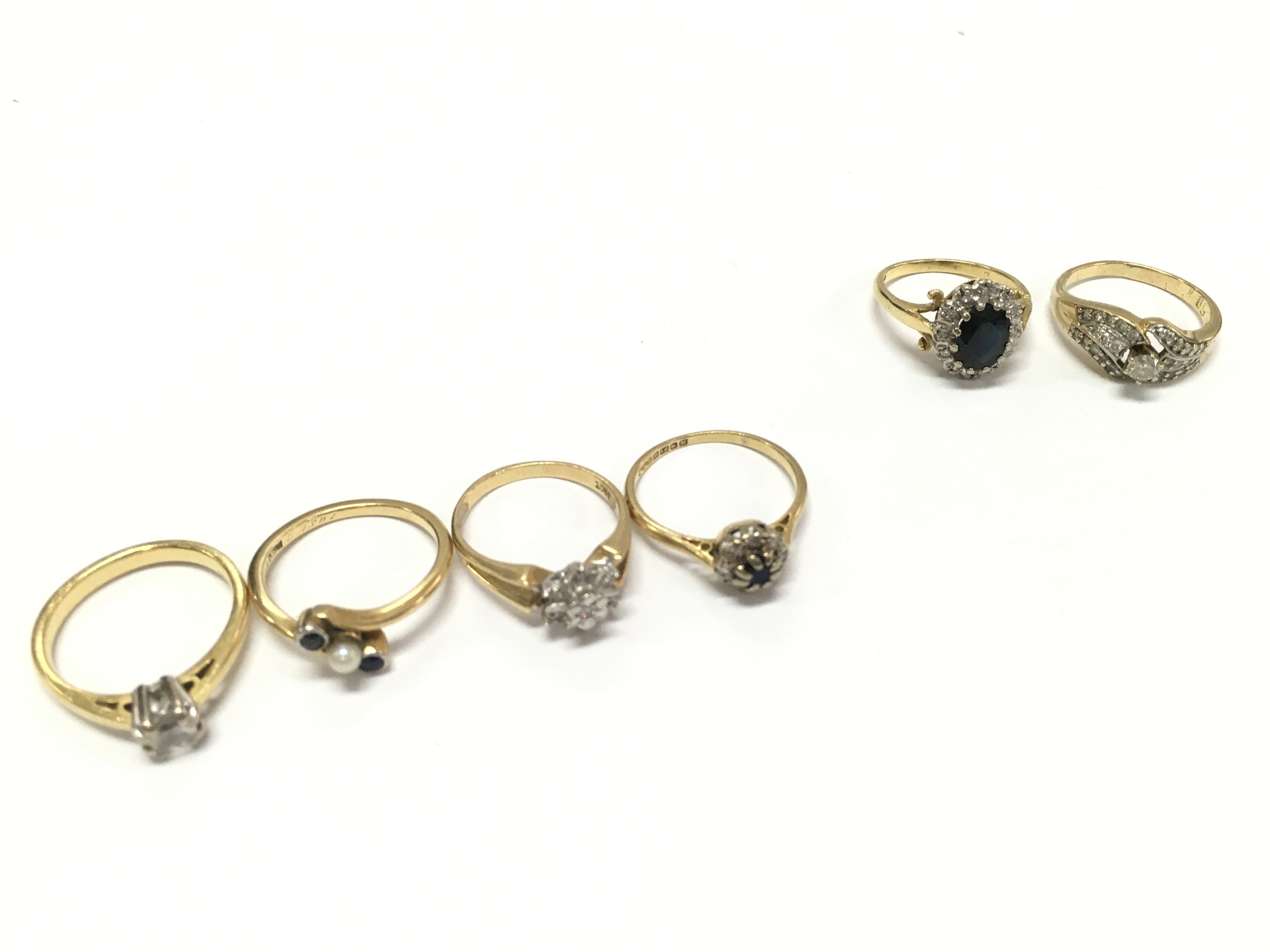 Four 18ct gold rings set with diamonds and various other stones and two unmarked gold rings sizes L,M,N. 21g total weight. postage category A