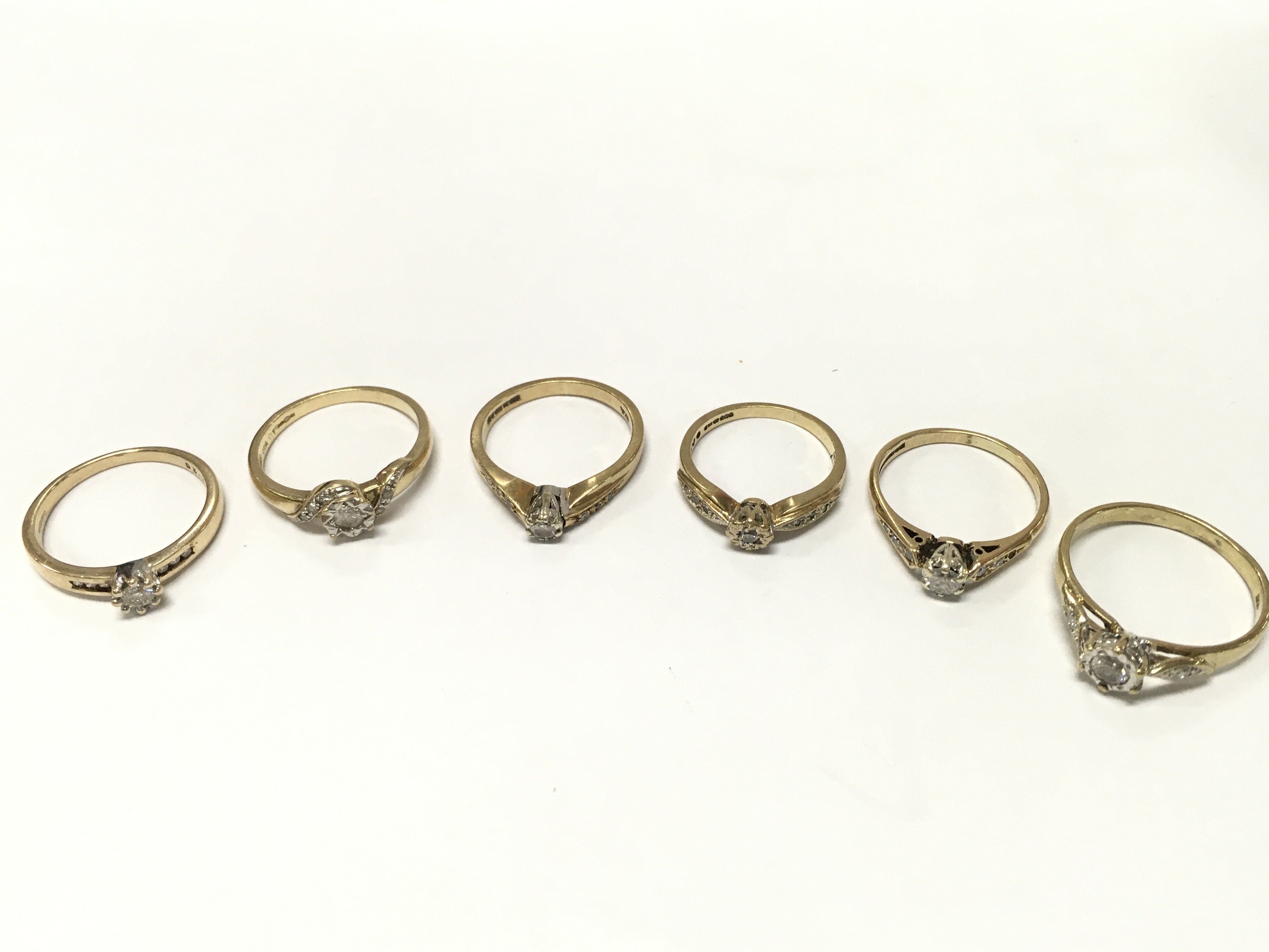9ct Gold rings set with diamond and Moissanite stones. 13g total weight. Postage category A