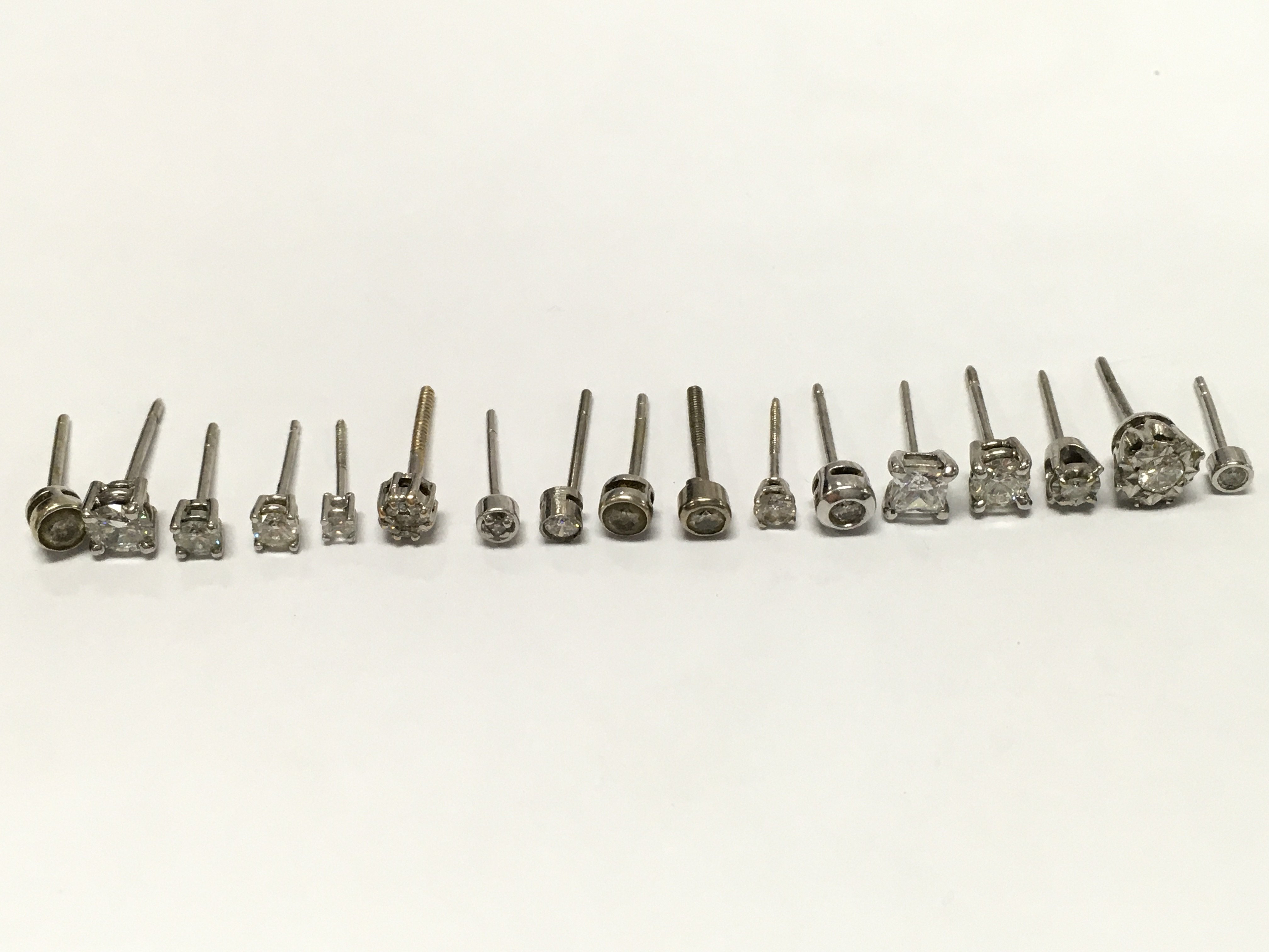 A Collection of high carat white gold earrings , 6.3G total weight. Postage category A