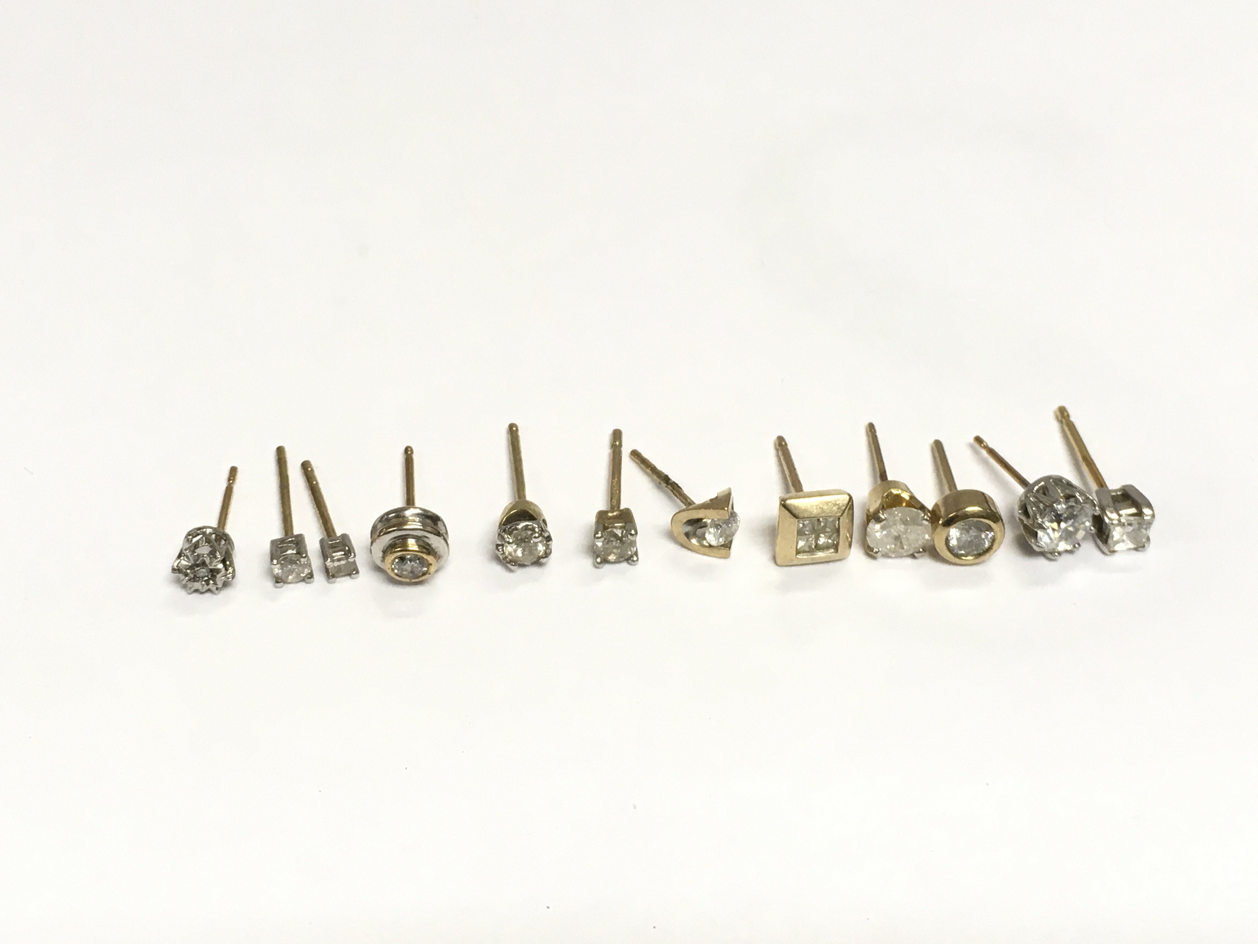 A collection of gold, diamond and moissanite ear studs, total approx 4.2g. Shipping category A.